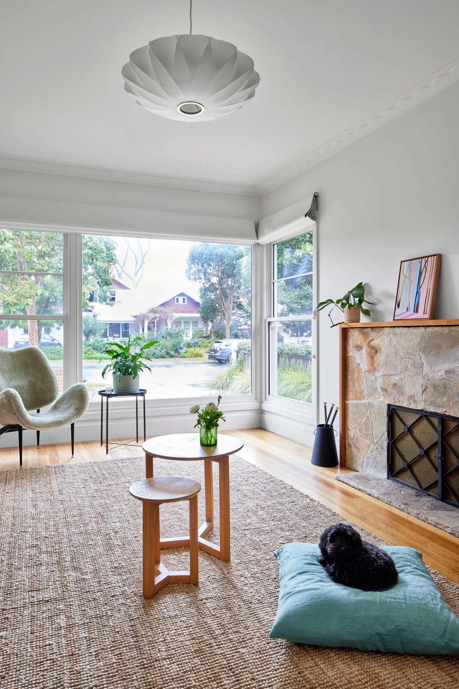 Post-war modern lounge room with stone fireplace.