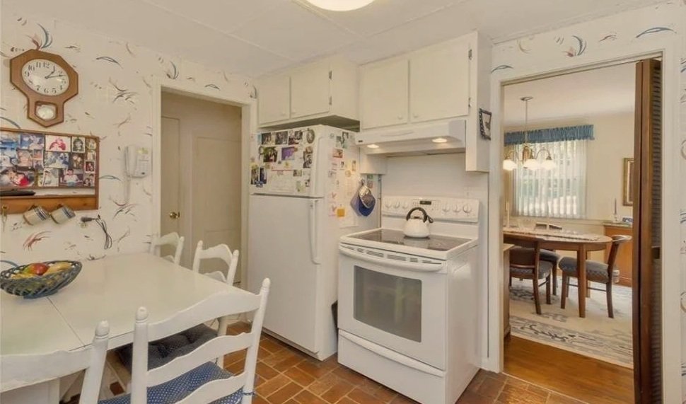 Before Renovation - Multiple access points created a small and enclosed kitchen.