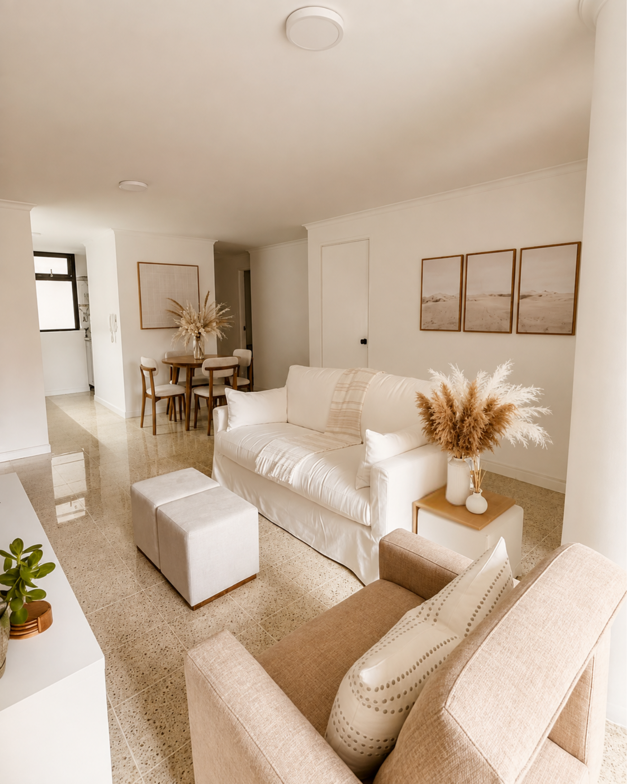Neutral living room, with natural elements, and soft furnishings.