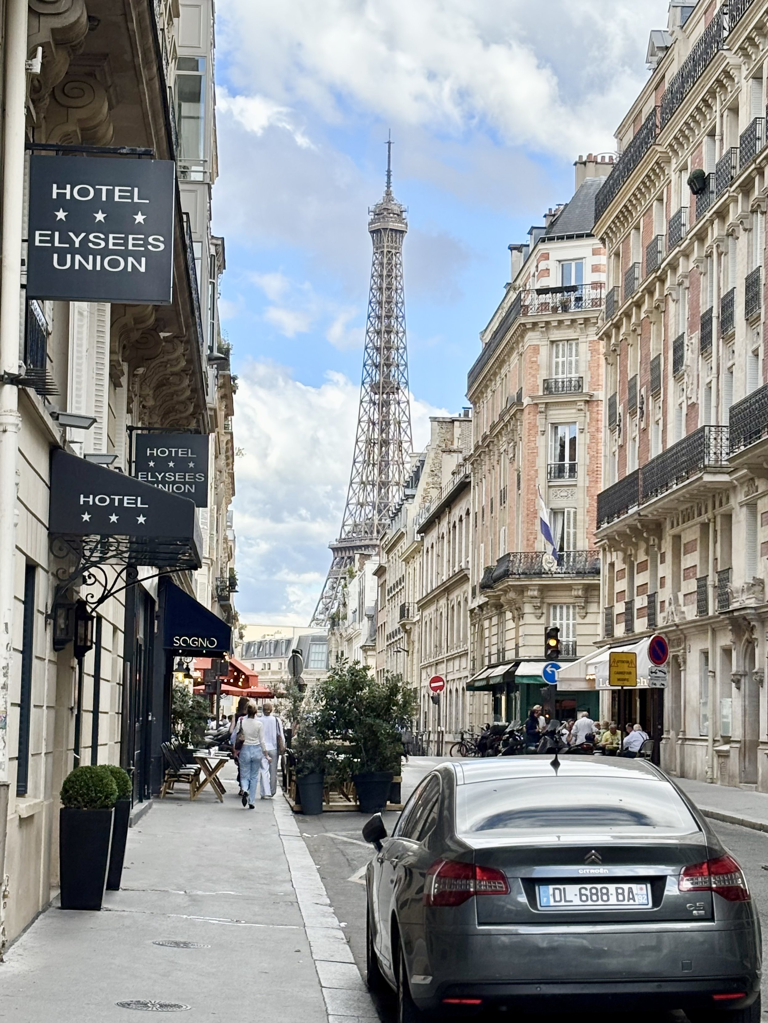 Eiffel Tower Peaking through streets of Paris.