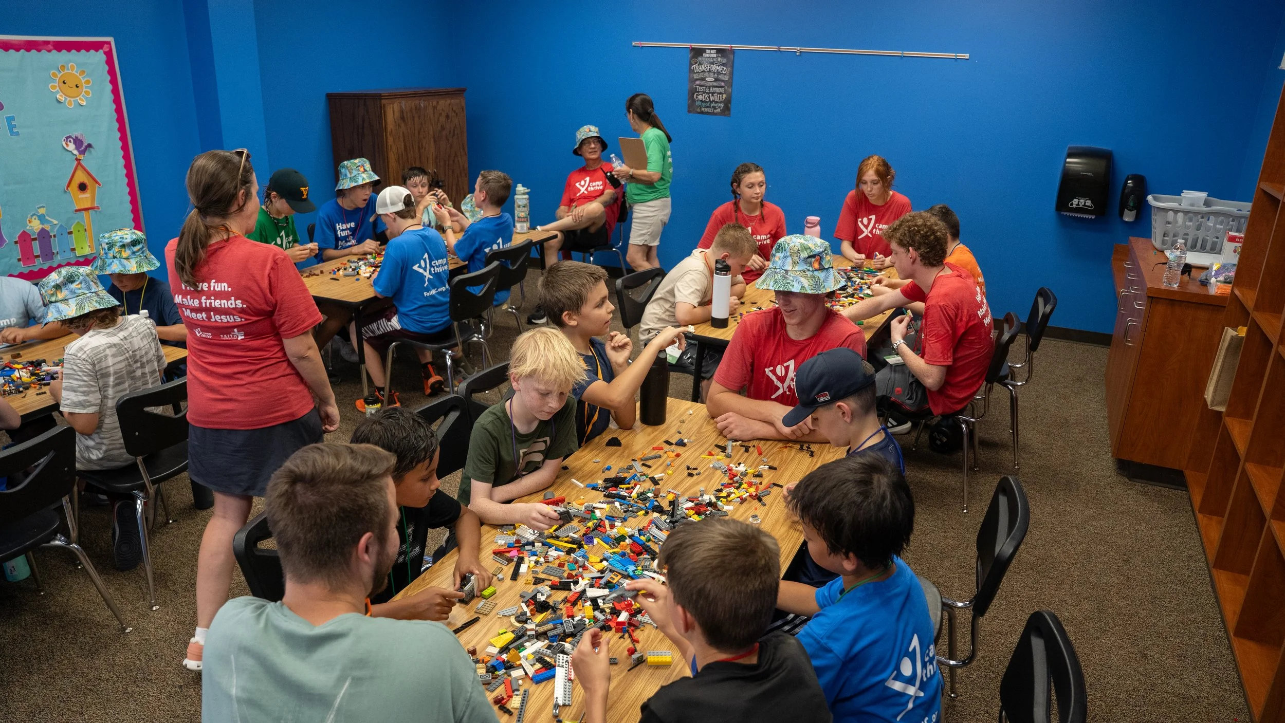 A large pile of multicolored LEGO bricks and pieces scattered randomly.