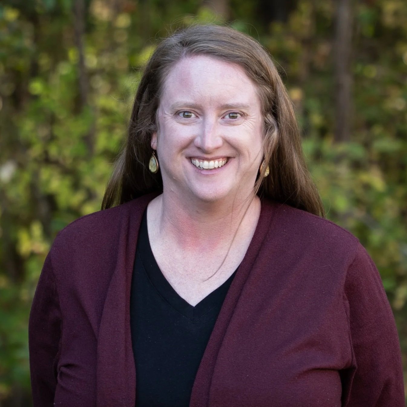 A logo with a dark teal background featuring a white letter 'F' with a stylized arrow and chevron design above it.