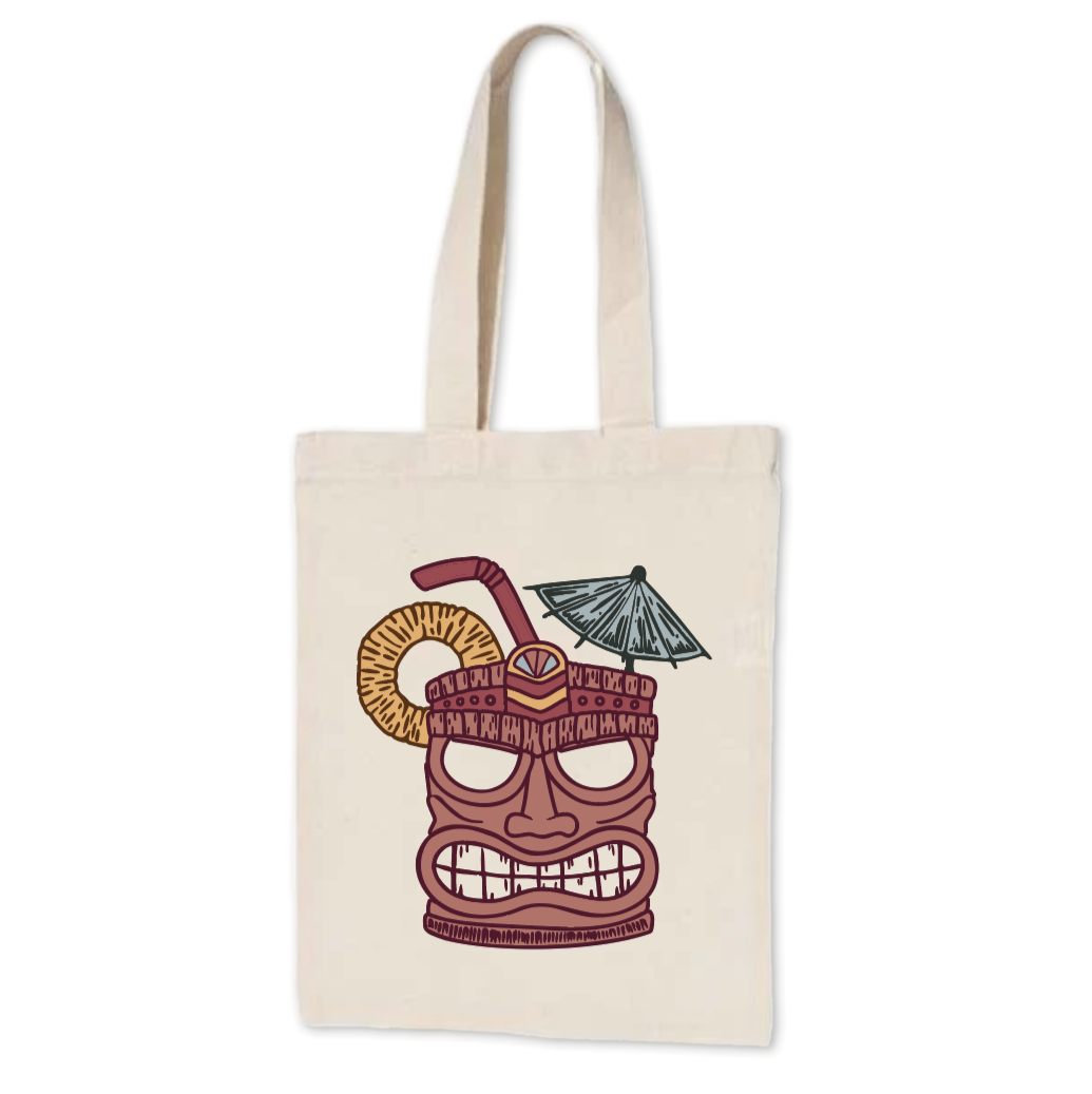 Canvas tote bag with a graphic of a tiki face wearing sunglasses, with a drink umbrella, a straw, and a ring-shaped snack around its head.