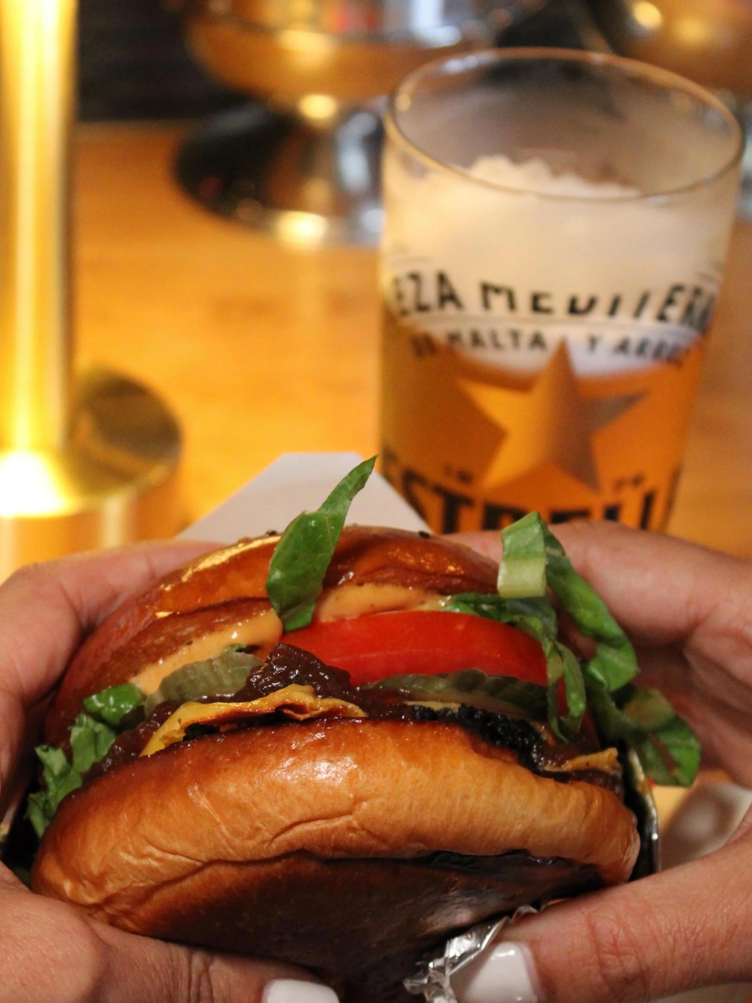 Celebrate National Burger Day at Tomorrowland. Pair a delicious @coneyburger with a beer or cocktail of your choice. 🍸🍻