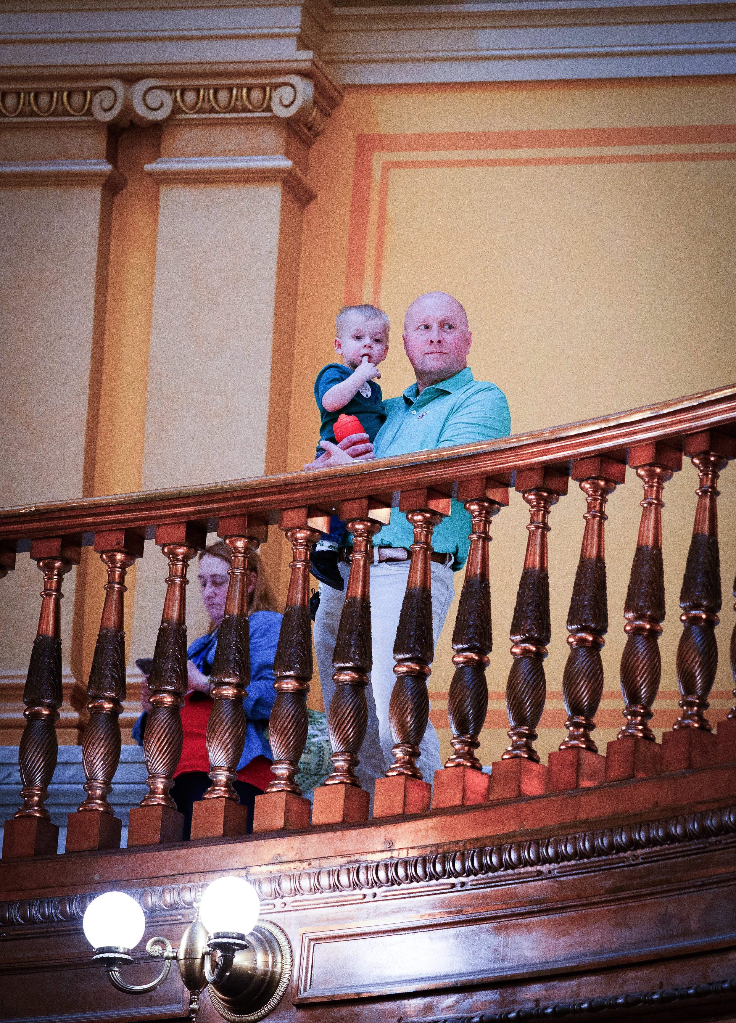   PHOTO COURTESY OF ANTHONY BUSH    Brian Schwanz and his grandson, Royal, watched the rally from the third-floor rotunda.  