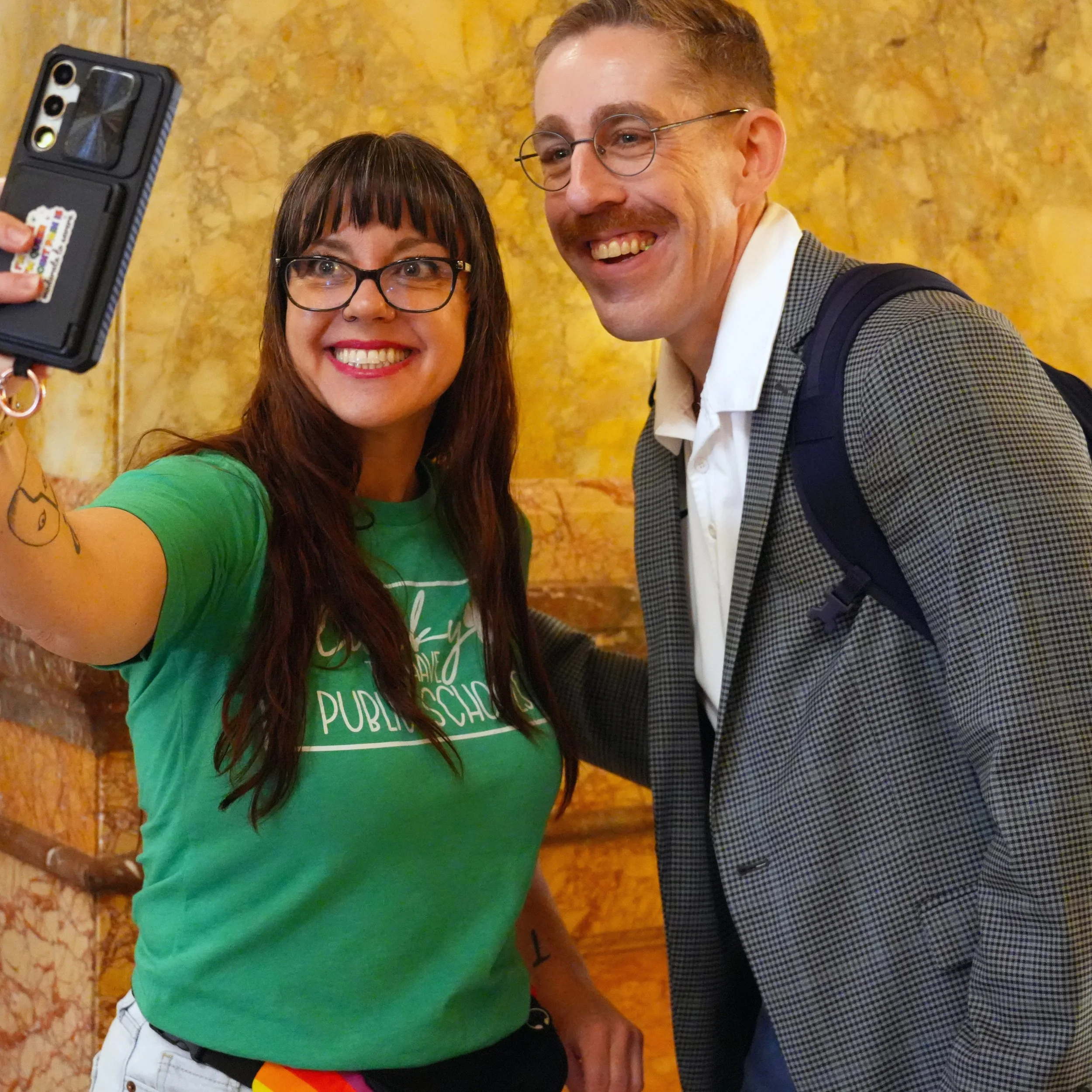   PHOTO BY MAKENZIE COCHRAN-DOCKERTY/KNEA    Angie Powers, Olathe NEA, and Jonathan Eshnaur, KNEA Secretary-Treasurer, posed for a selfie at the rally on Tuesday, March 17.  