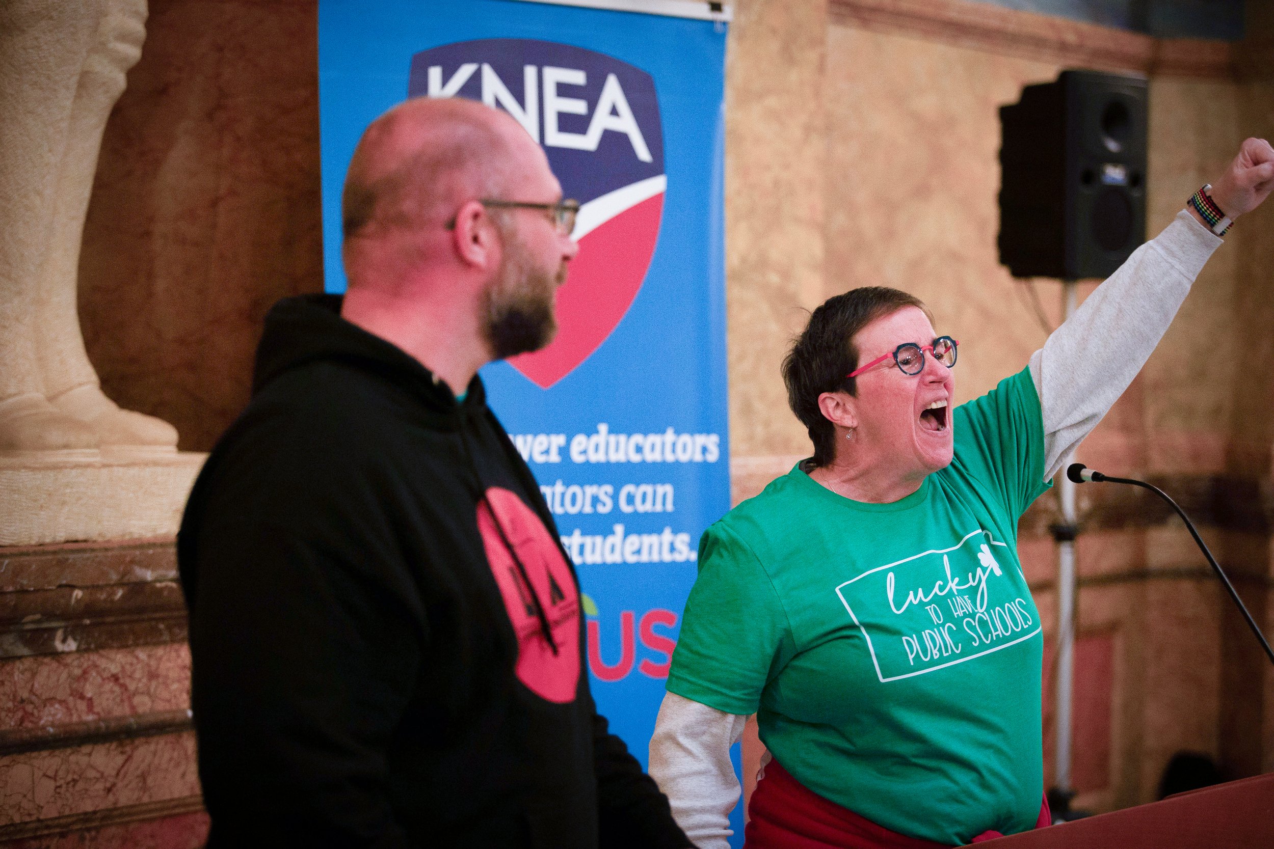   PHOTO COURTESY OF ANTHONY BUSH    Danita Long, Lawrence Education Association, lead a chant at the rally.  