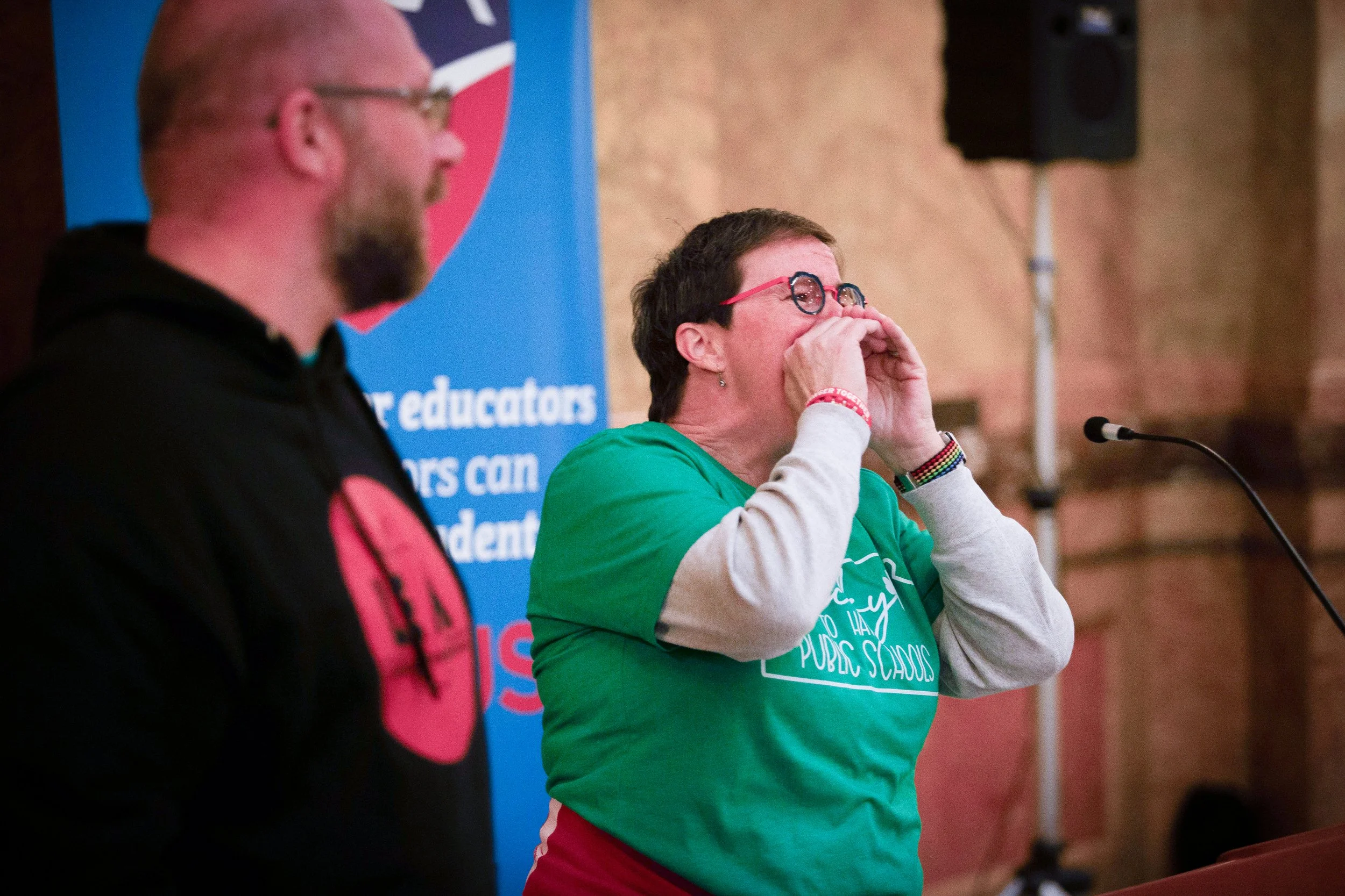   PHOTO COURTESY OF ANTHONY BUSH    Danita Long, Lawrence Education Association, lead a chant at the rally.  