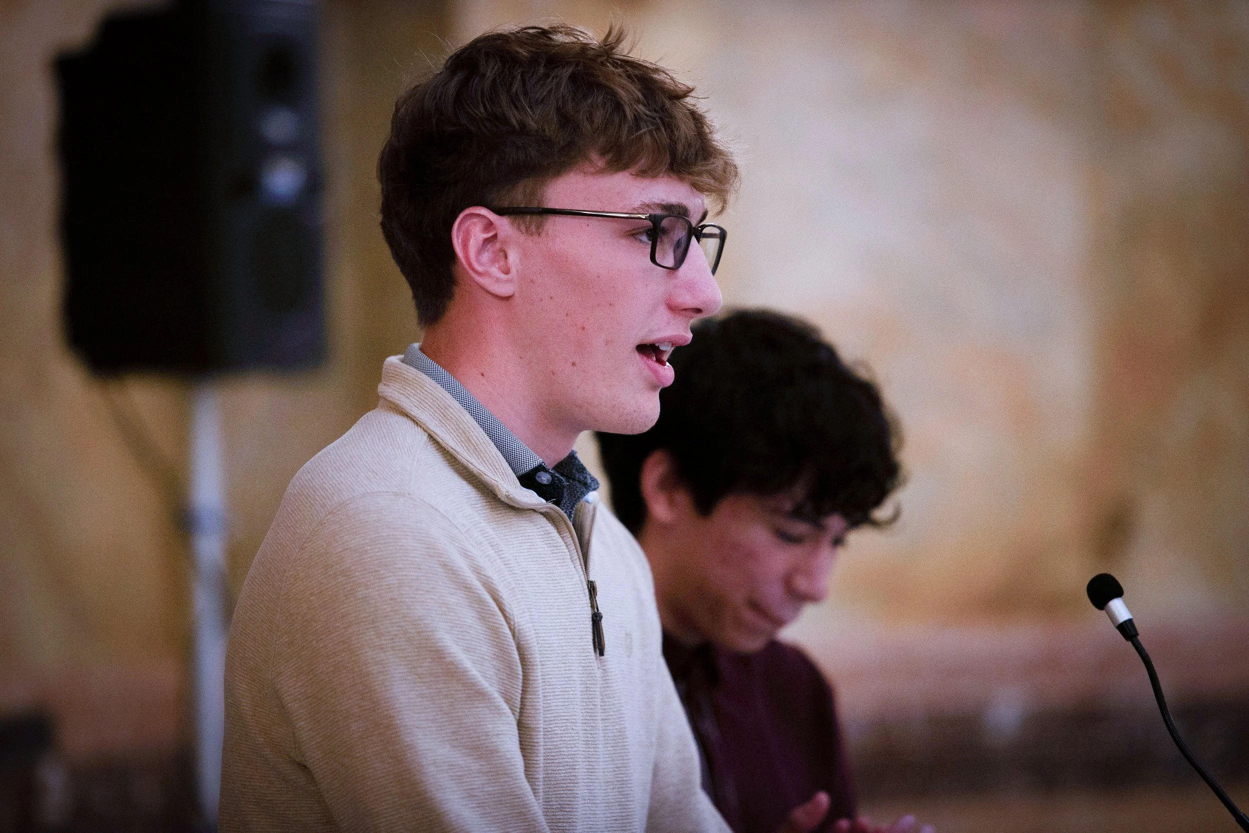   PHOTO COURTESY OF ANTHONY BUSH    Nathan Stigers, foreground, and Edgar Ruiz, students at Shawnee Mission North High School, spoke at the rally.  