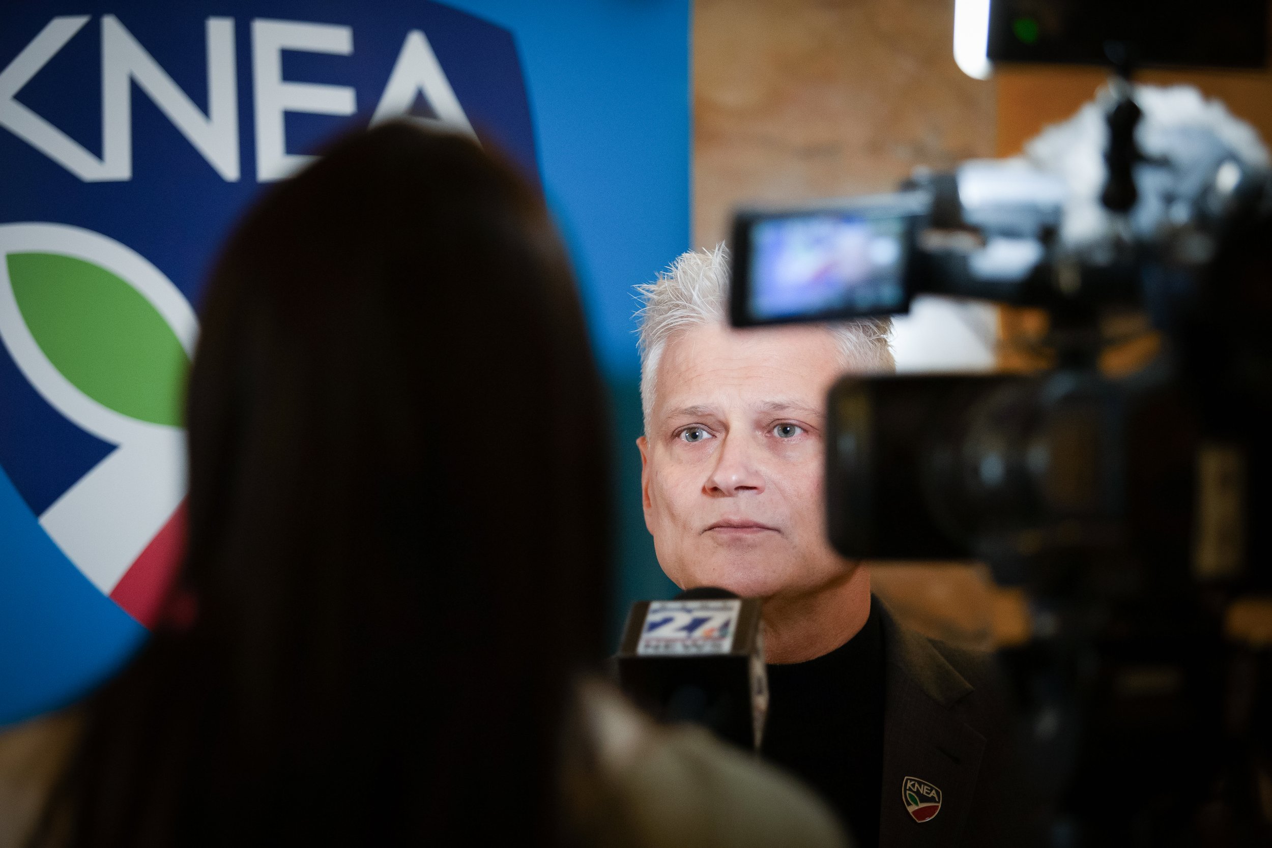   PHOTO COURTESY OF ANTHONY BUSH    Timothy R. Graham, Director of Government Relations for KNEA, was interviewed for a segment about the rally.  