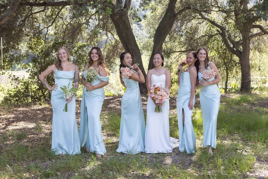 Bride and bridesmaids with colorful spring bouquets at a Central Coast ranch wedding