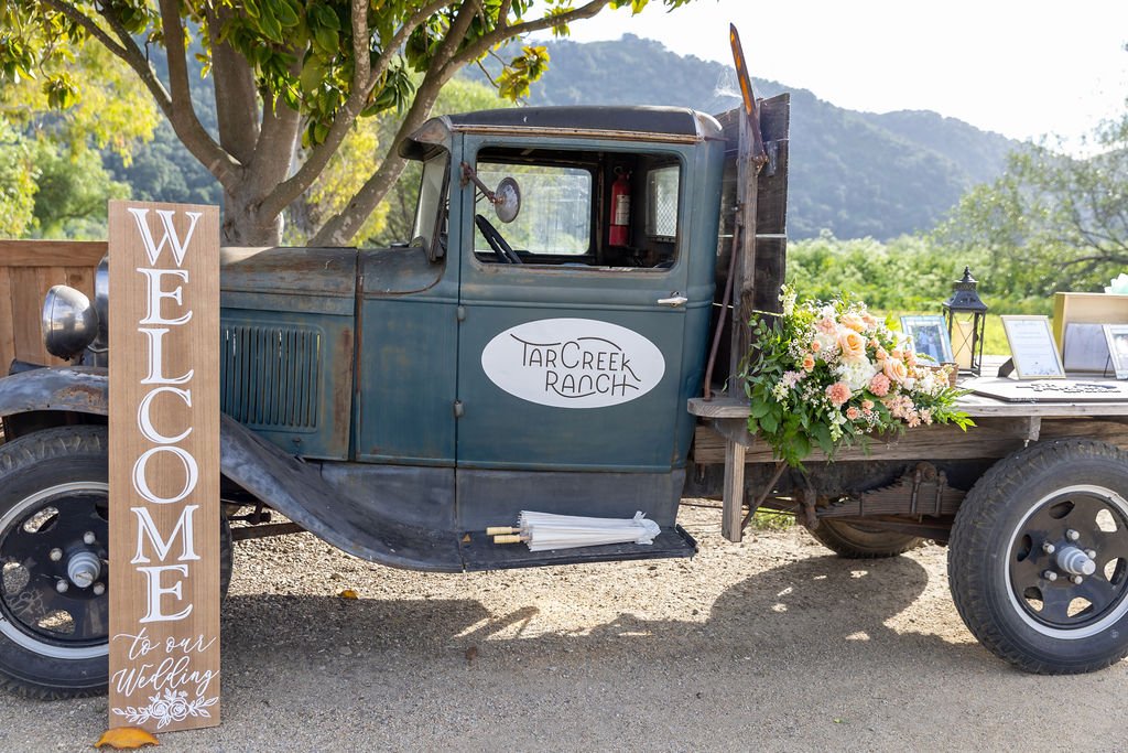 Vintage ranch truck wedding welcome display at Tar Creek Ranch