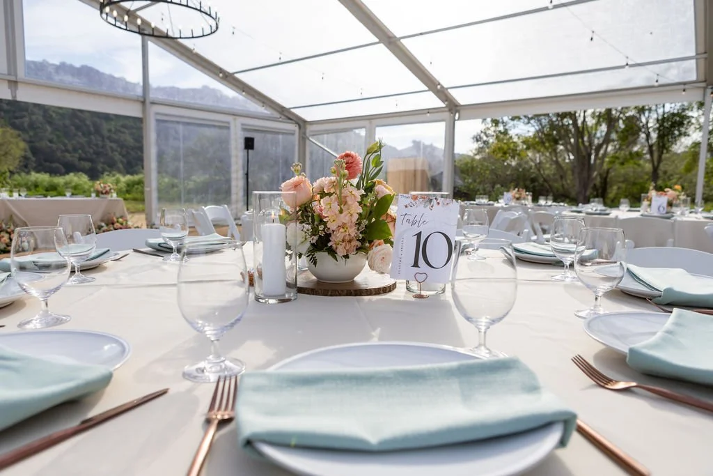 Elegant spring wedding table setting beneath the Magnolia Pavilion