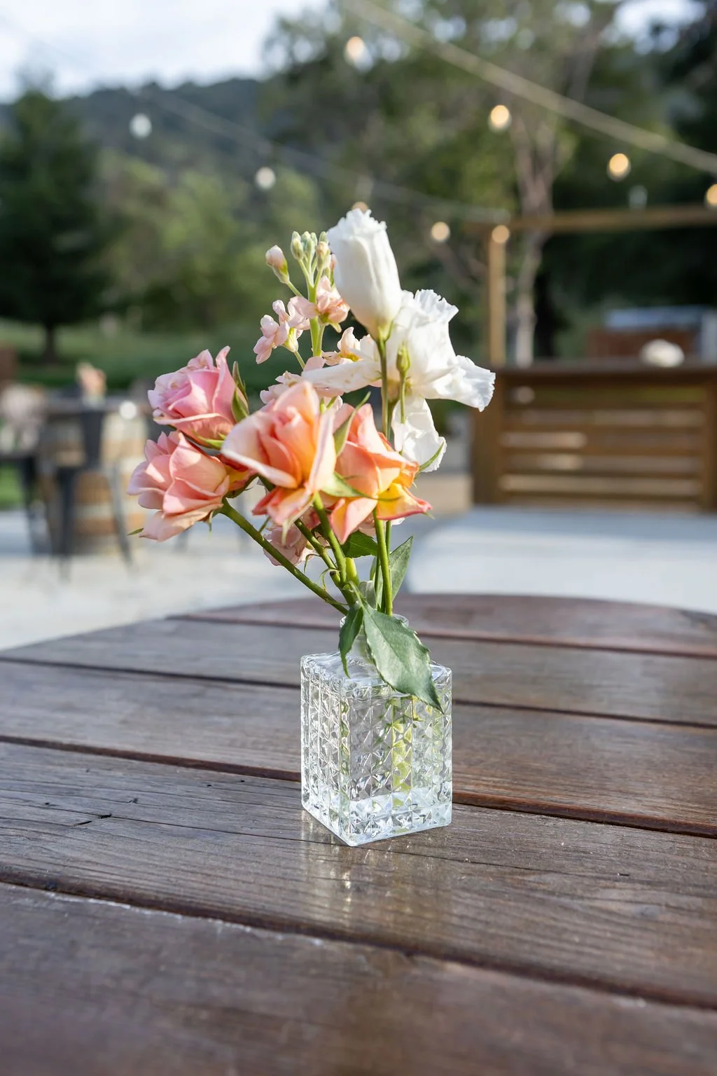 Peach and white spring flowers on a Garden cocktail table at Tar Creek Ranch