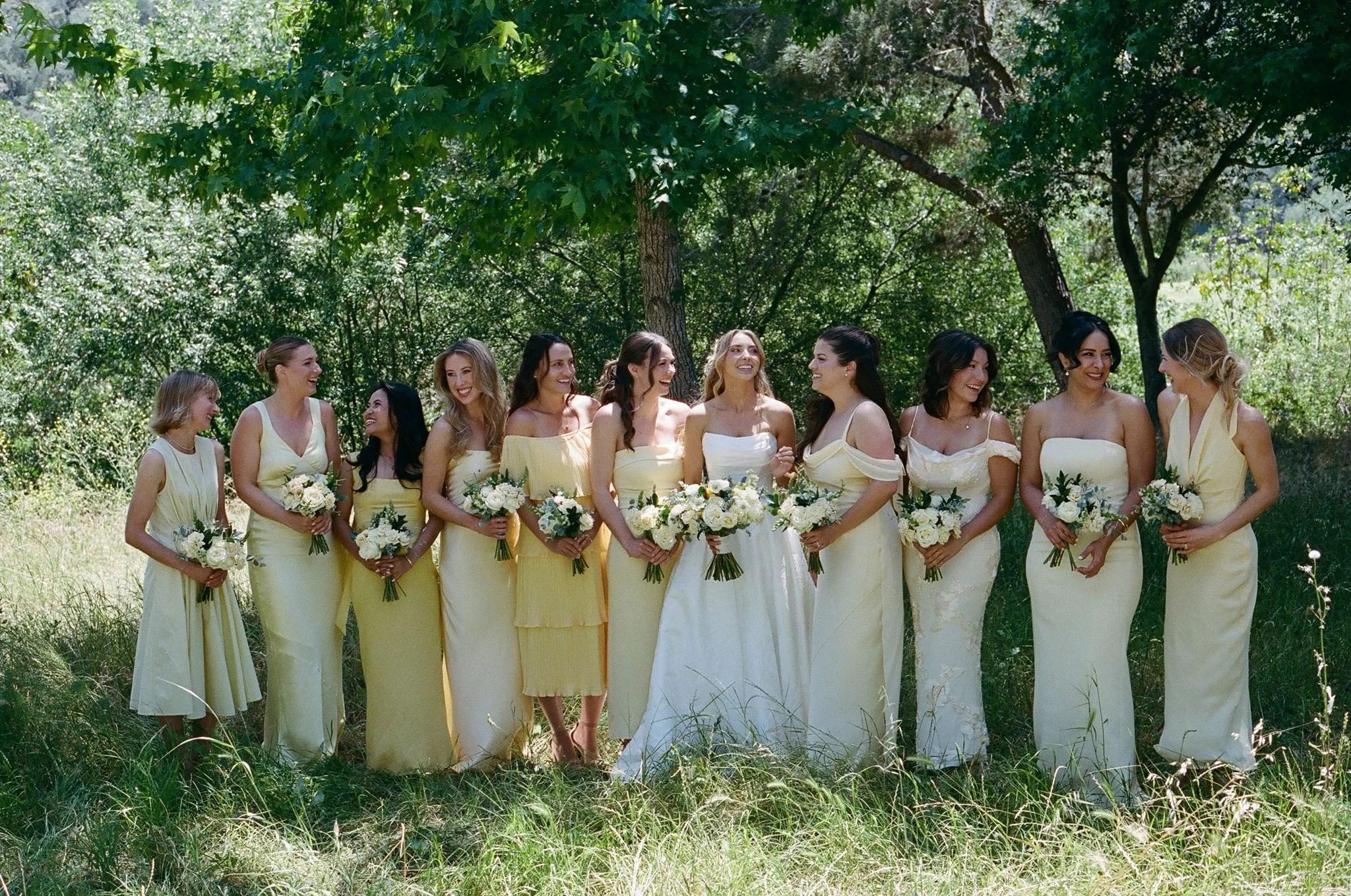 Bride and bridesmaids in butter-yellow dresses at Tar Creek Ranch