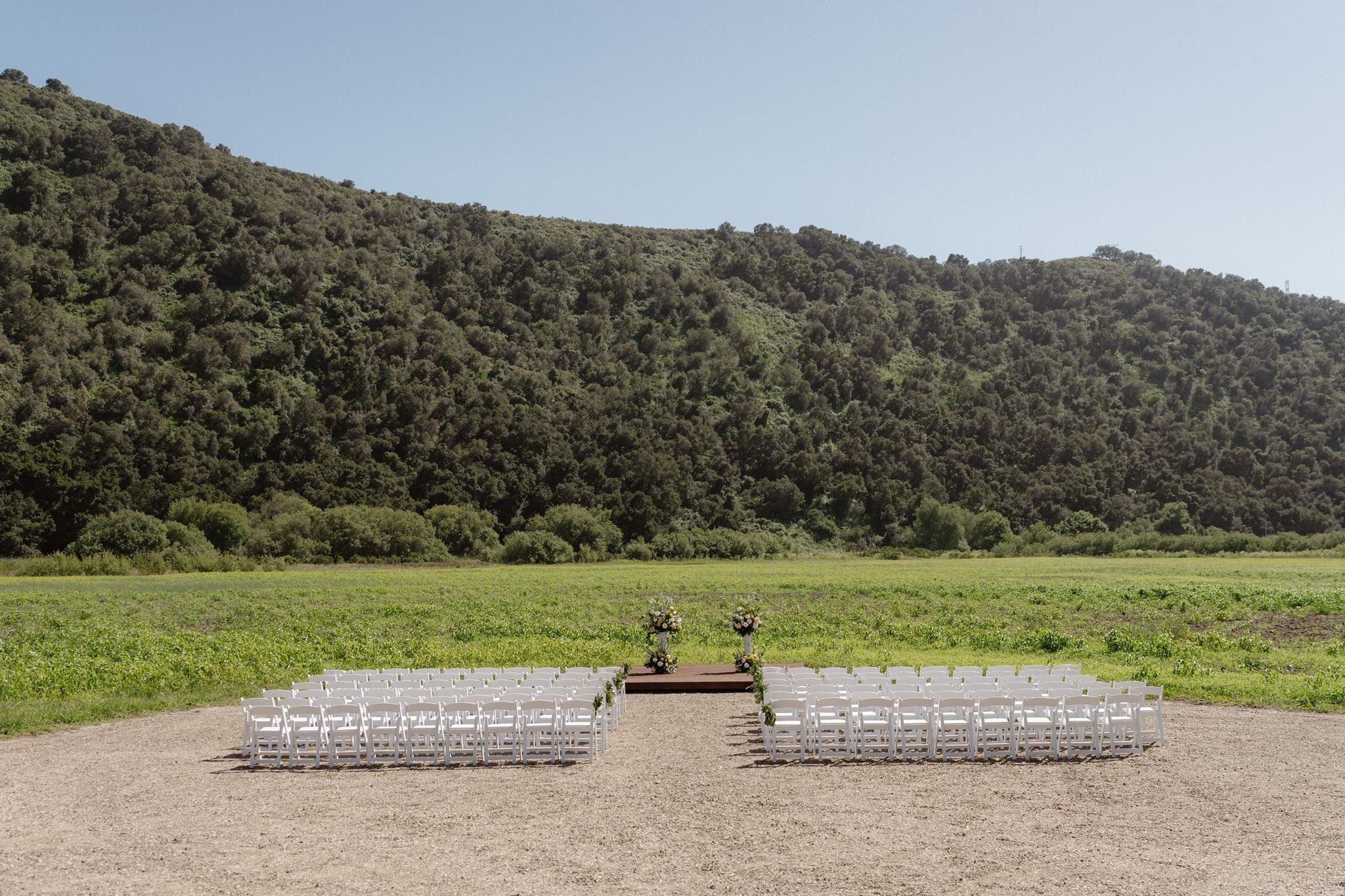 Early-May Meadow wedding ceremony setup at Tar Creek Ranch