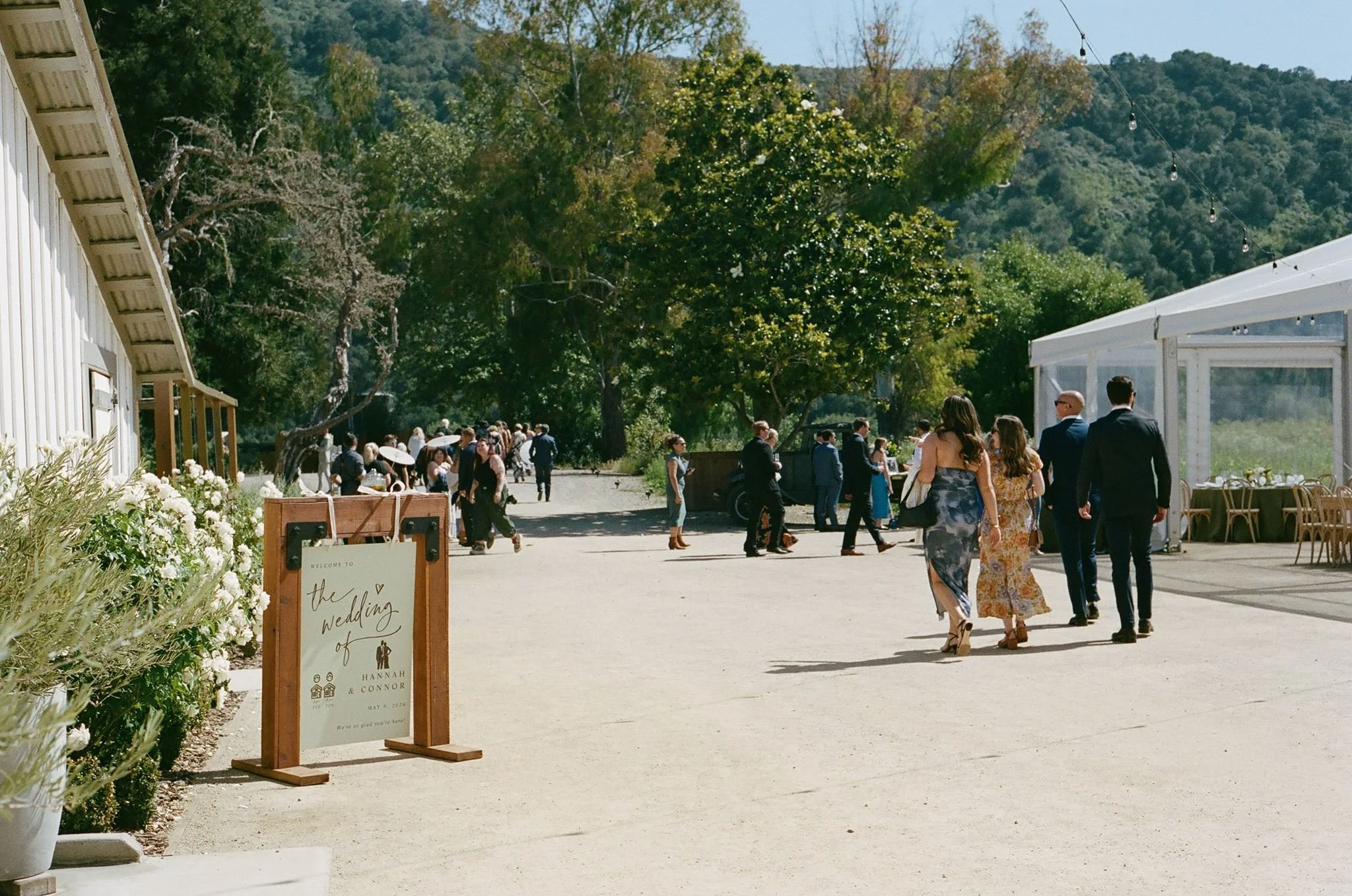 Guests arriving between the barn and Pavilion at Tar Creek Ranch