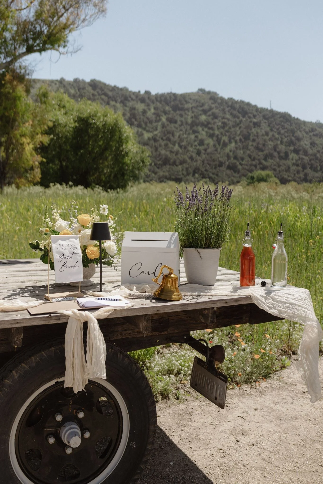 Personalized guest-book and brass bell display at Tar Creek Ranch