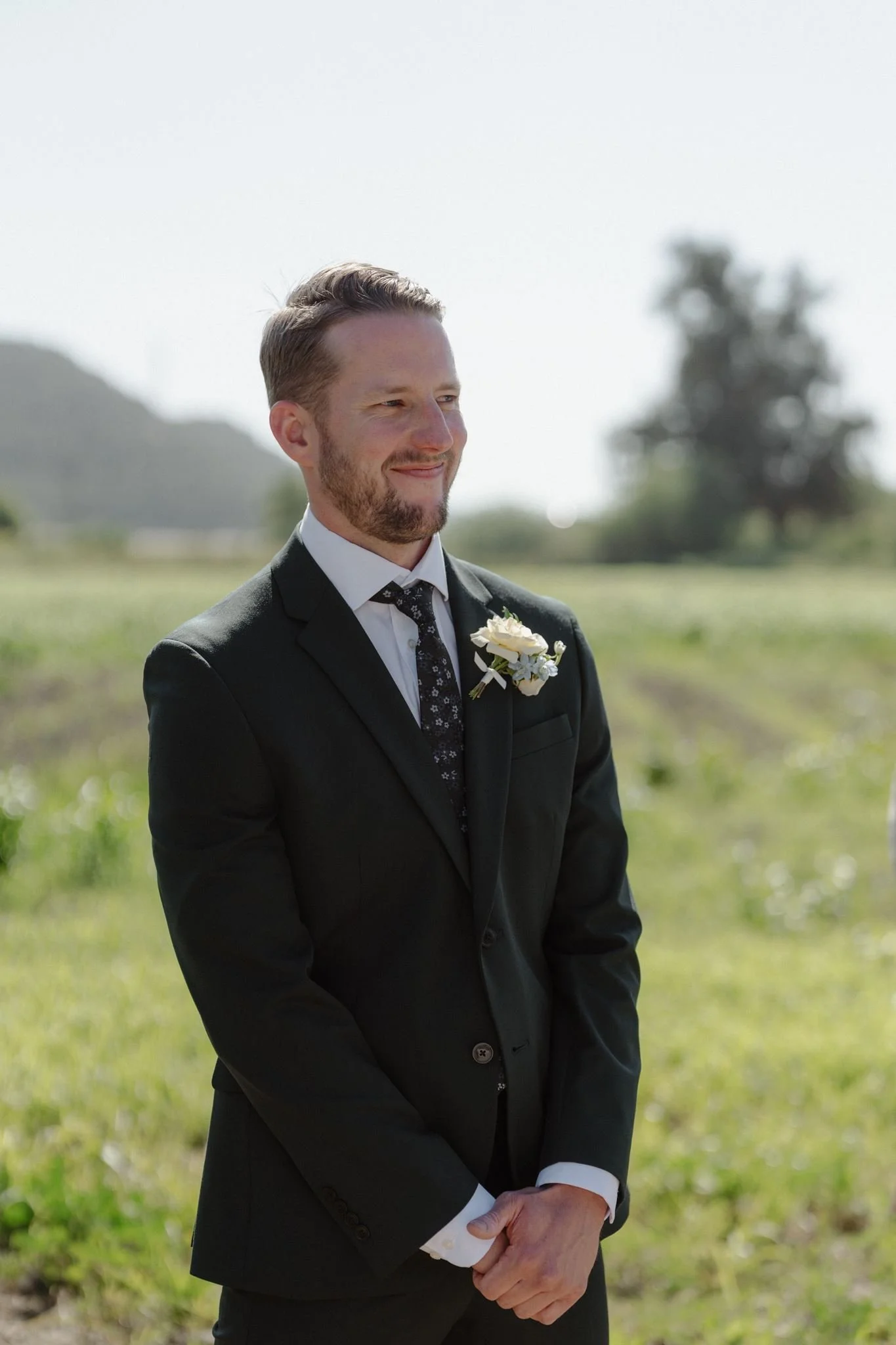 Connor waiting for Hannah at their Meadow ceremony at Tar Creek Ranch