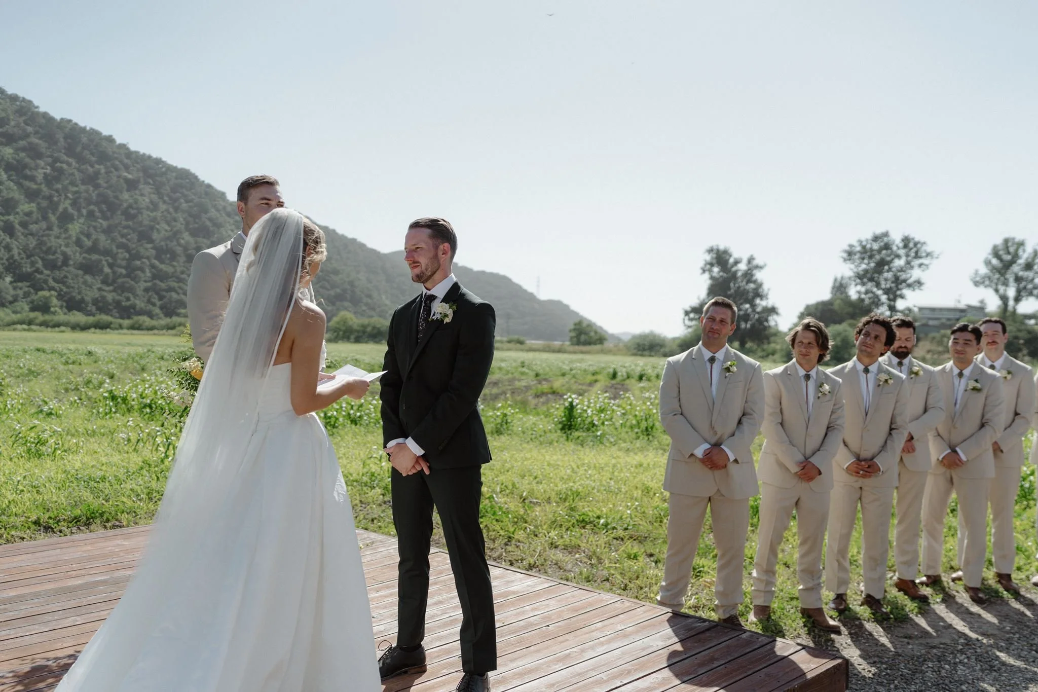 Hannah reciting vows during an early-May Meadow wedding at Tar Creek Ranch