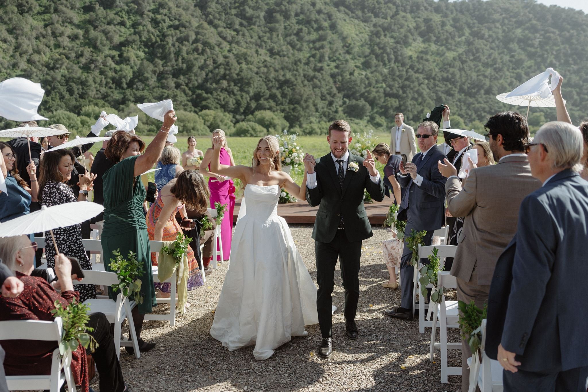 Hannah and Connor's joyful Meadow ceremony recessional at Tar Creek Ranch