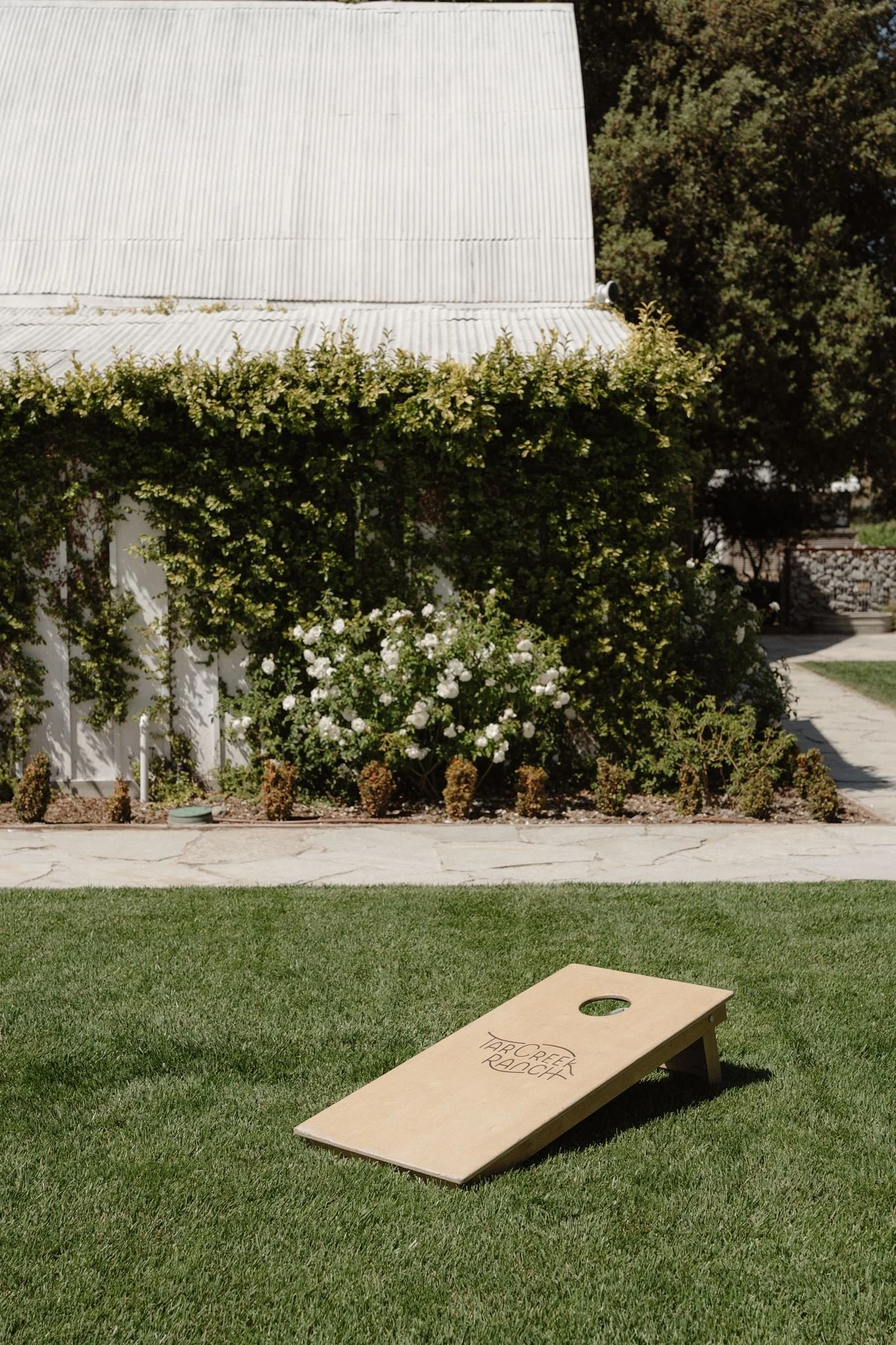 Cornhole lawn game during Garden cocktail hour at Tar Creek Ranch