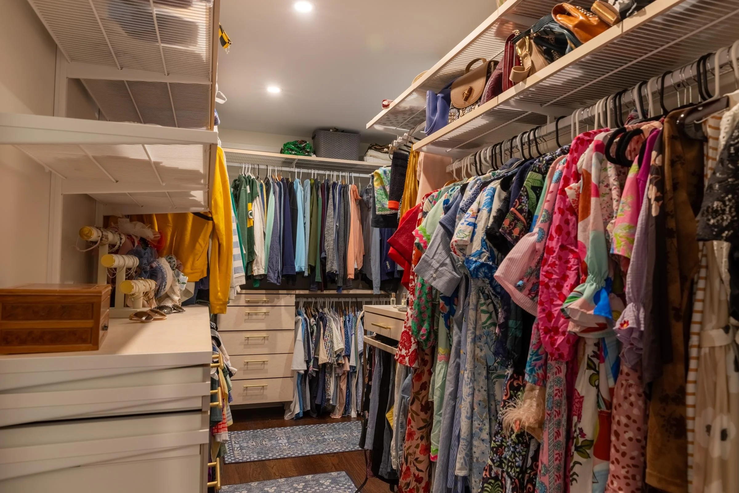 Custom walk-in closet with open shelving and double hanging rods from a Charlotte, NC whole-home renovation