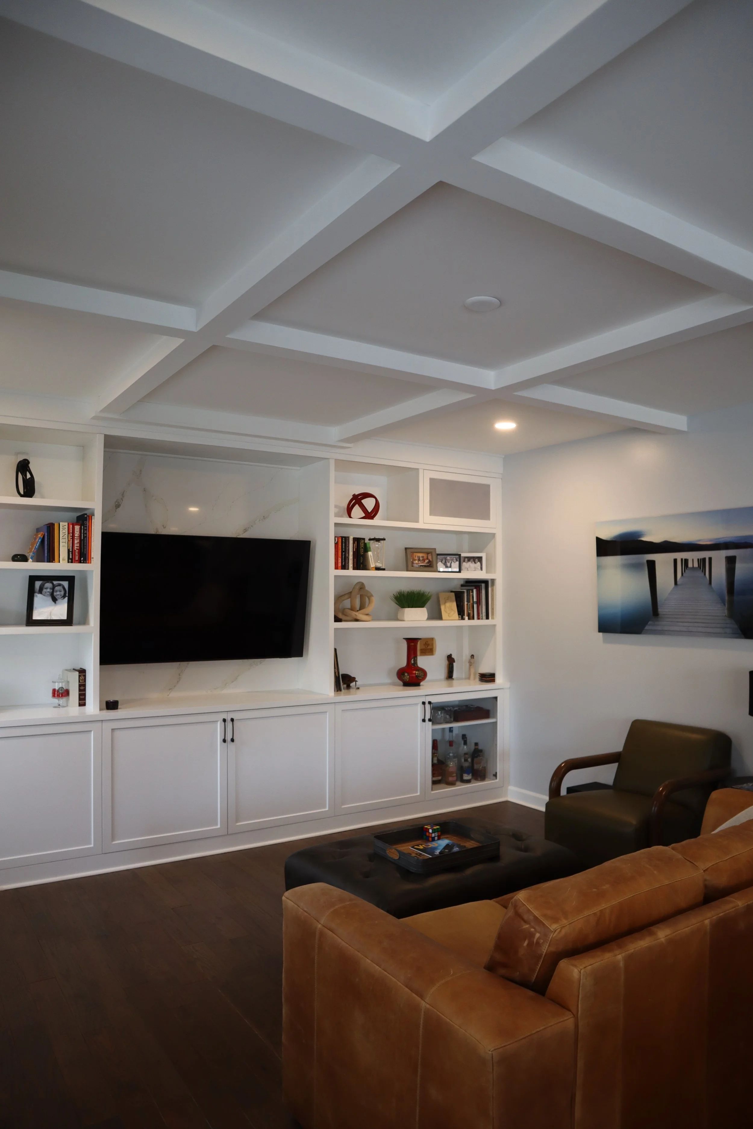 Coffered ceiling and custom built-in media cabinetry from a Charlotte, NC whole-home renovation