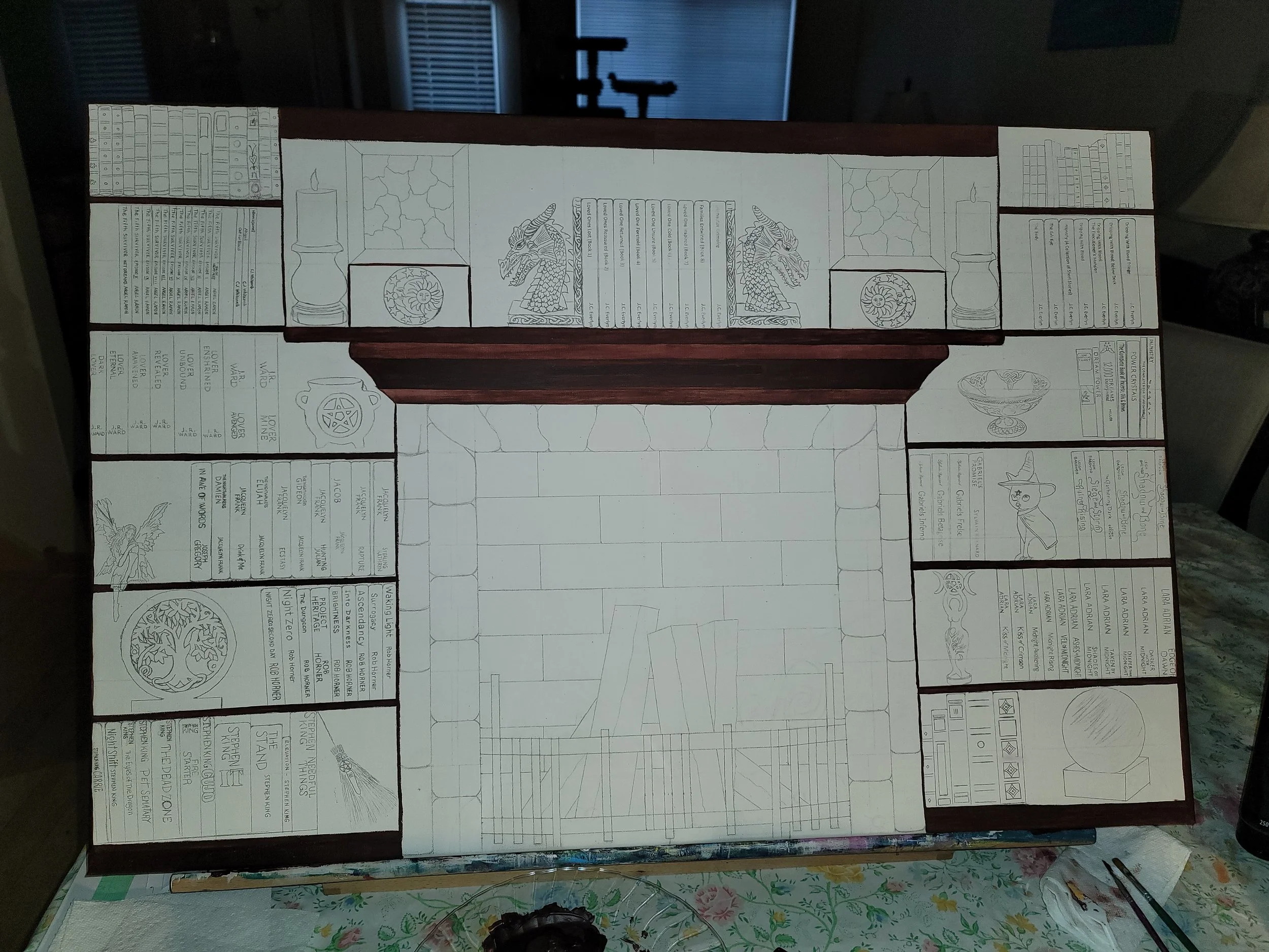 Preliminary sketch of detailed bookshelves with various sections, illustrations, and text, including a stone archway, dragons, fire, and decorative elements.