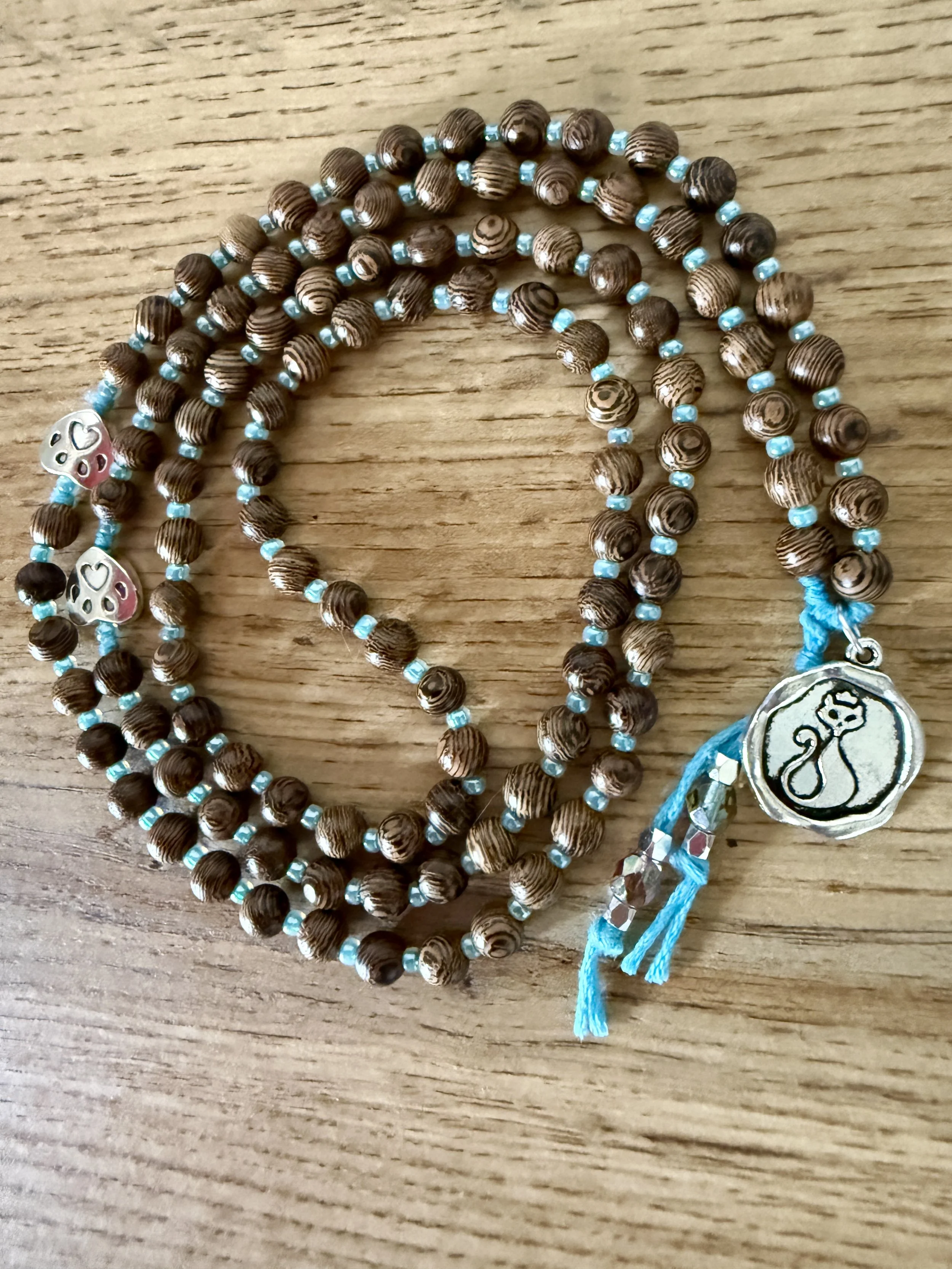 brown striped wood beads cat pendant.jpg