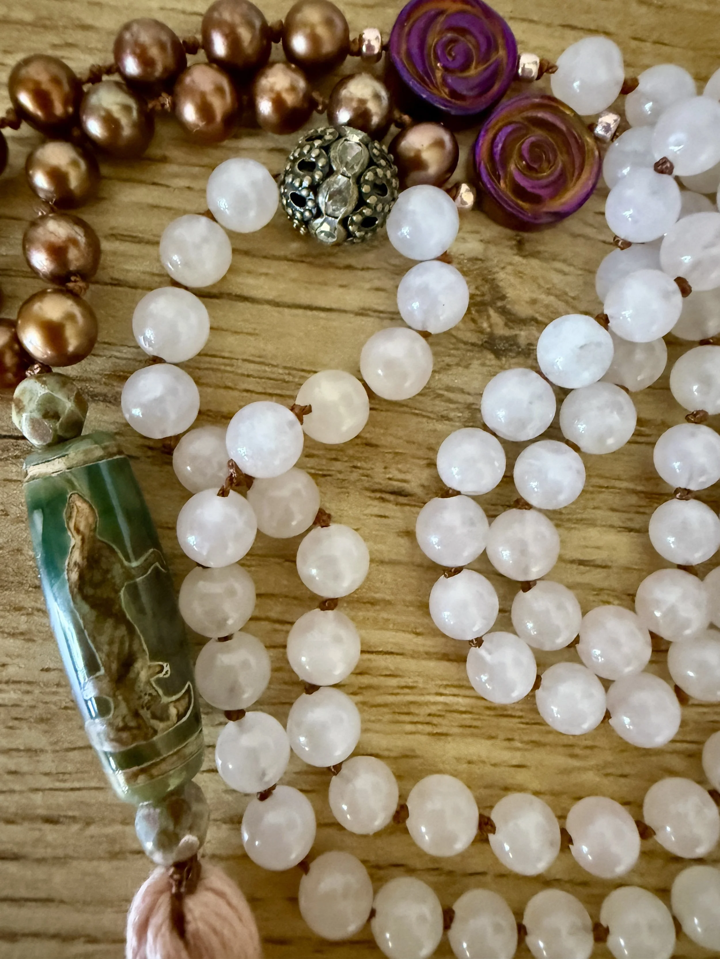rose quartz with quan yin guru bead.jpg