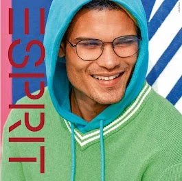 Young man smiling, wearing glasses, a mint green hoodie with white drawstrings, and a blue hood over a striped shirt.