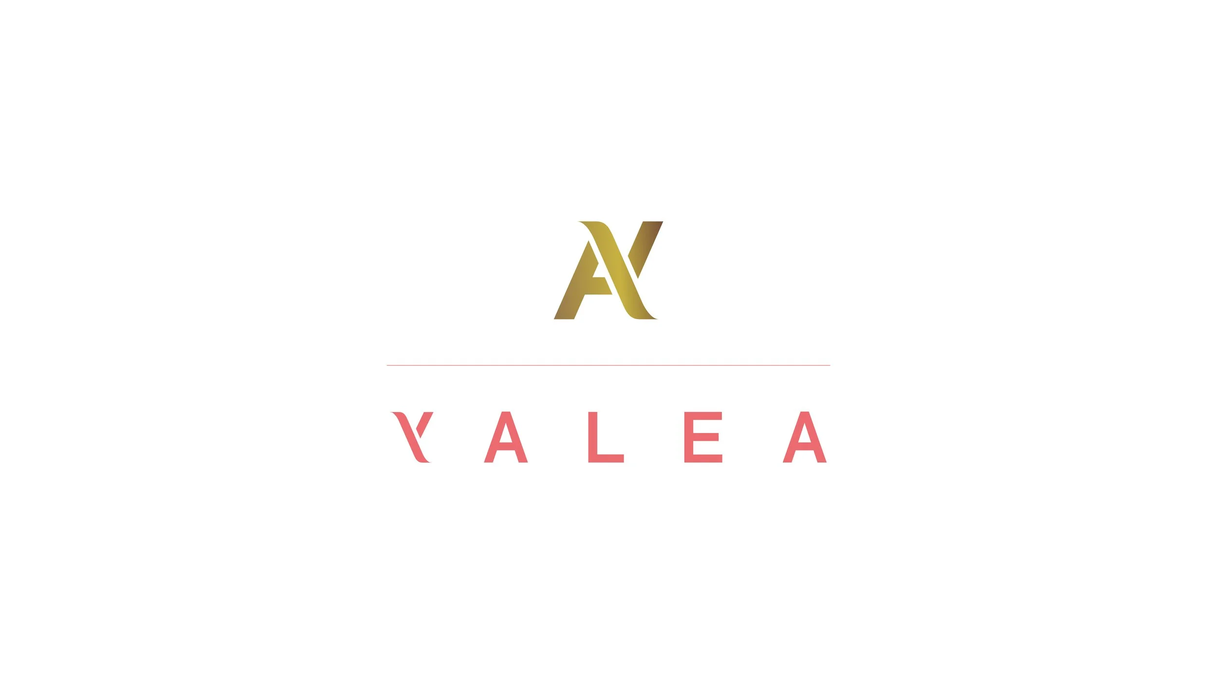 A white background with a stylized gold logo that appears to be a combination of the letters A and V. Below the logo, there is a thin red horizontal line. Underneath the line, the word 'VALEA' is written in pink uppercase letters with an artistic fon