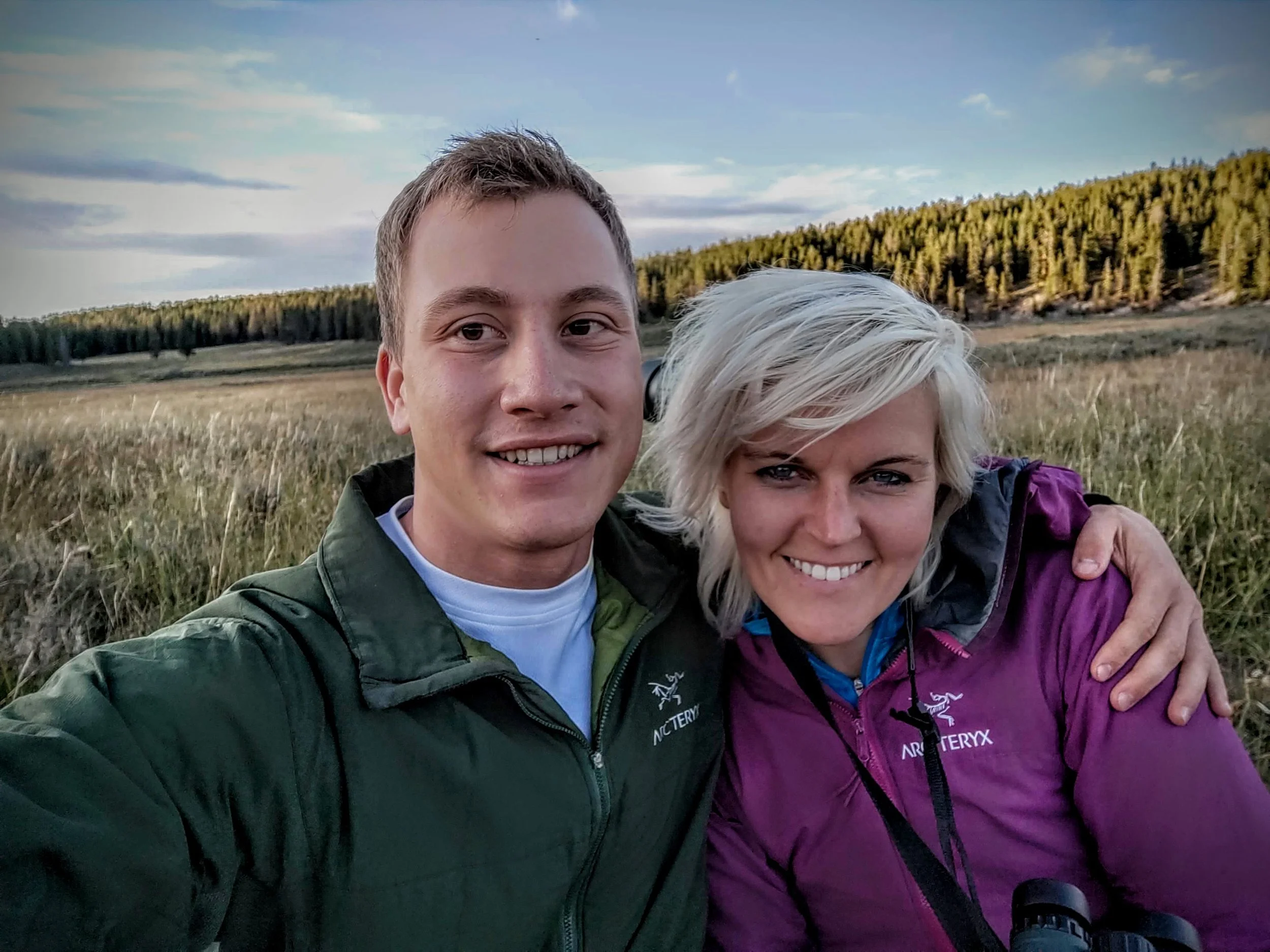 Joe and Sarah-Marie in a meadow at golden hour