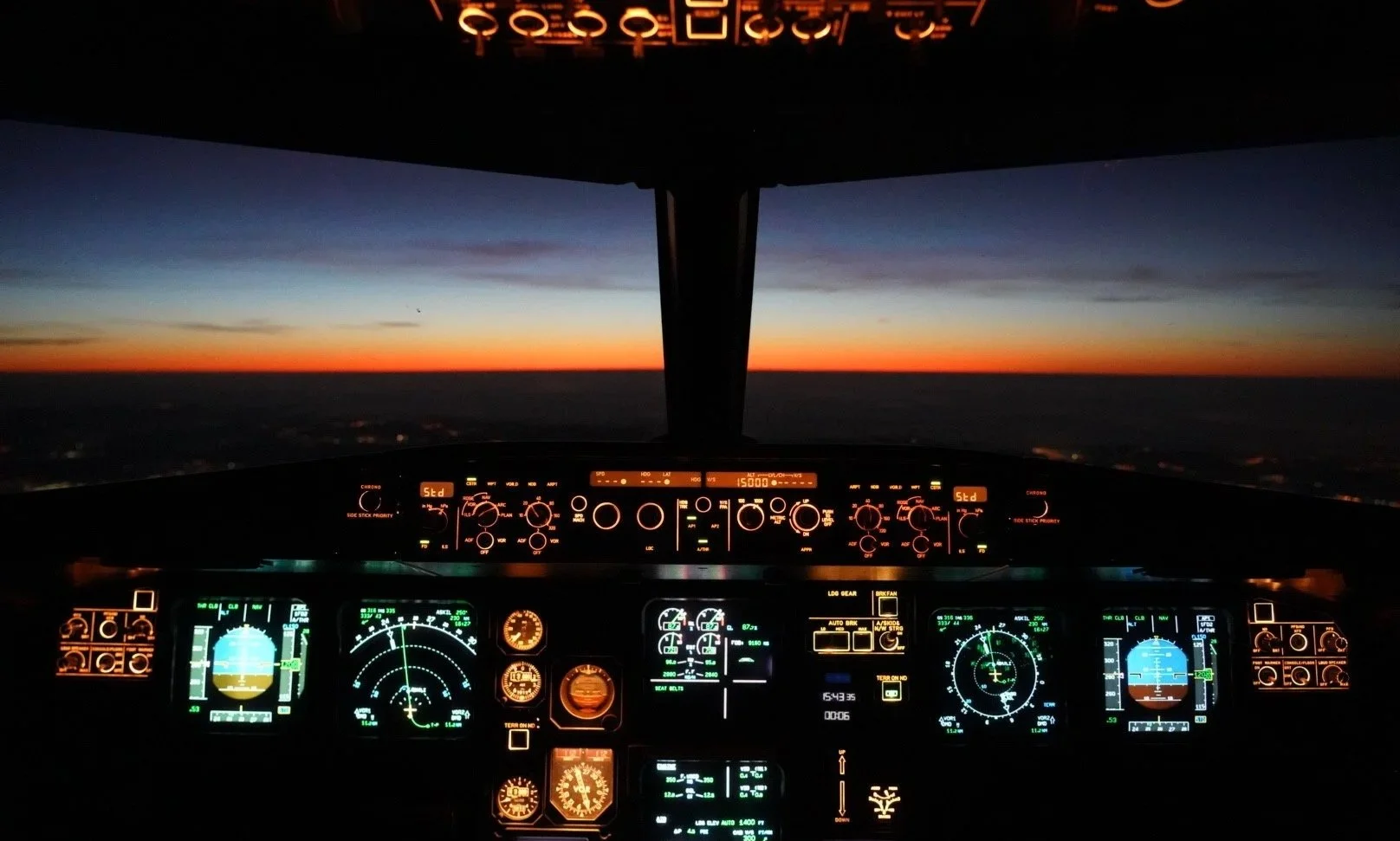 cockpit-view-sunset-aviation-photography-dario-caduff.jpg