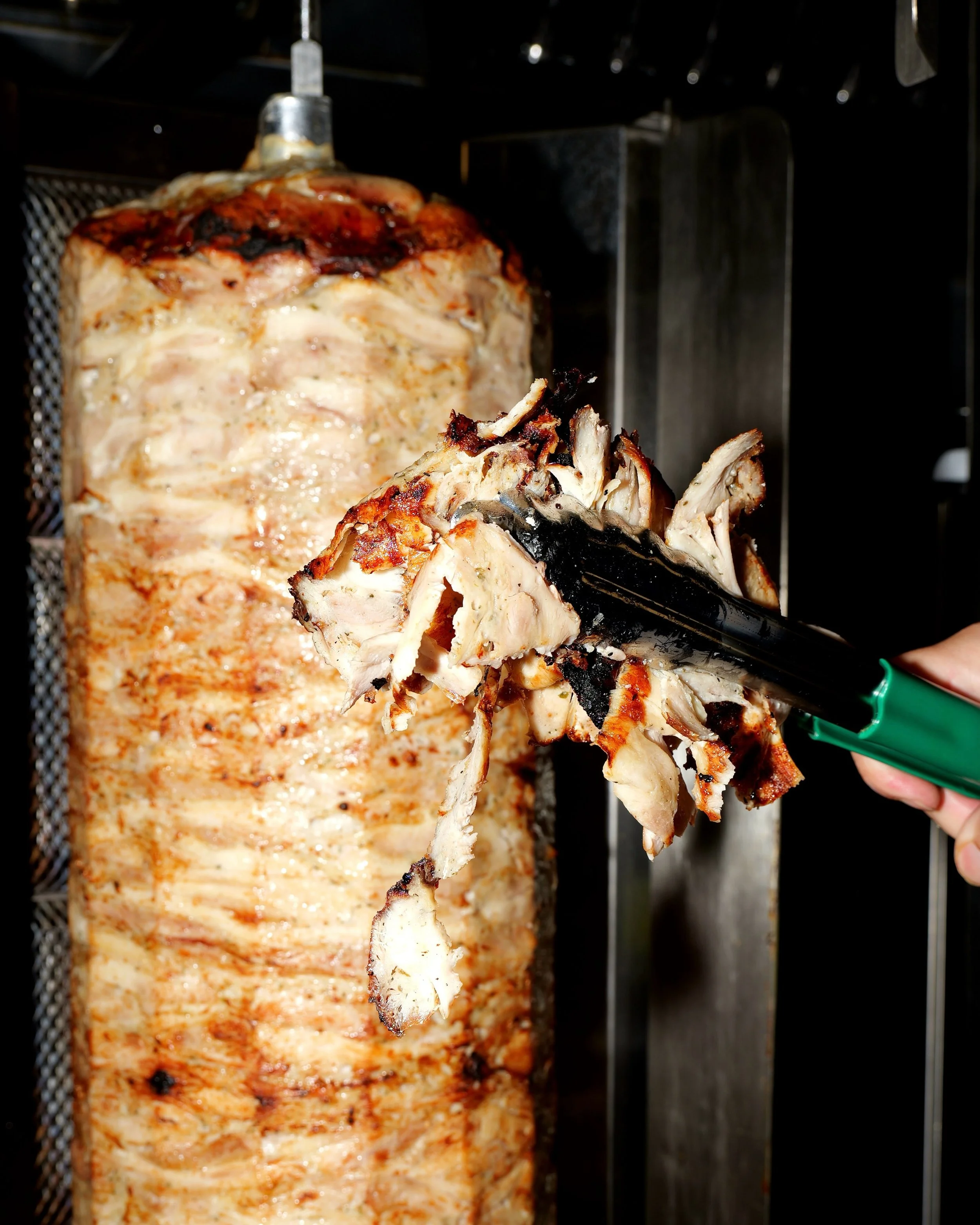 Here&rsquo;s where the chicken gyros magic happens 🔥

The meat is stacked onto our vertical rotisserie, cooked until golden, and then carved fresh throughout the day.

Then it&rsquo;s over to you. Gyros wrap, platter, rice box or salad?