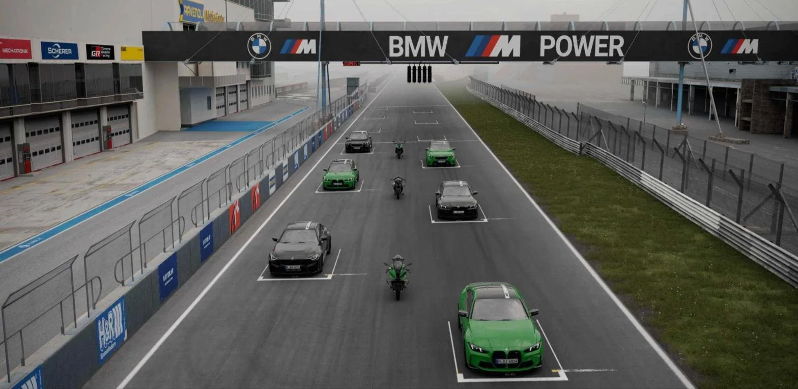 BMW M 100 Jahre Nürburgring edition M2, M3, M4 and M5 models lined up on the Nürburgring grid in Nürburgring Green and Black Sapphire