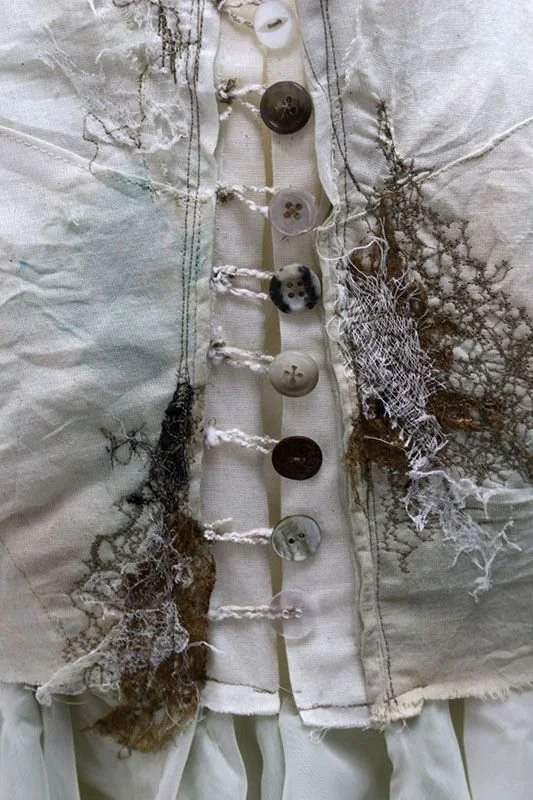 white Lace textiles with grey buttons - women's old clothes as art.