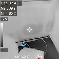 Trapped moisture on exterior wall shown in greyscale.