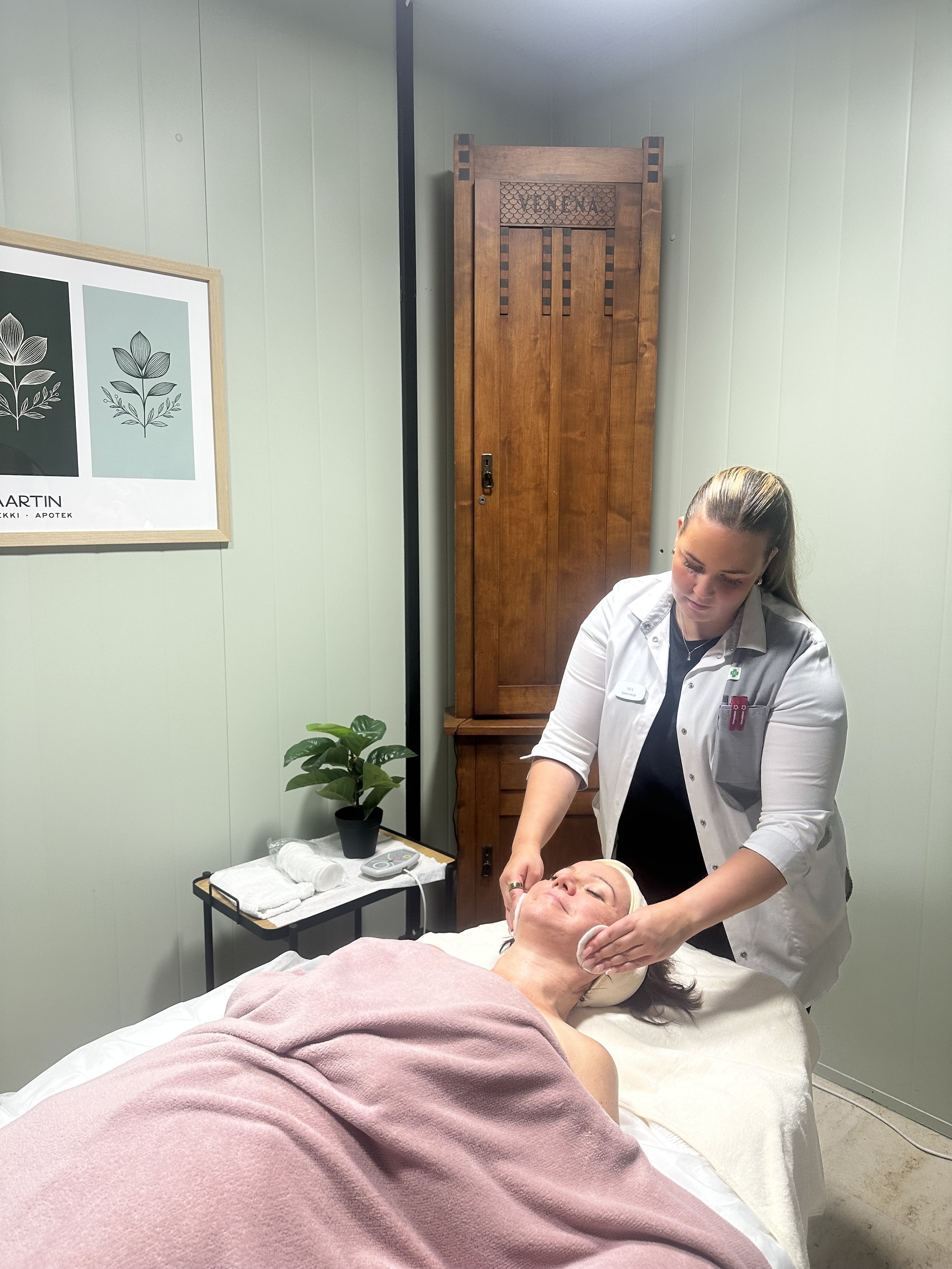 Beautician undergoing a Swissline facial treatment