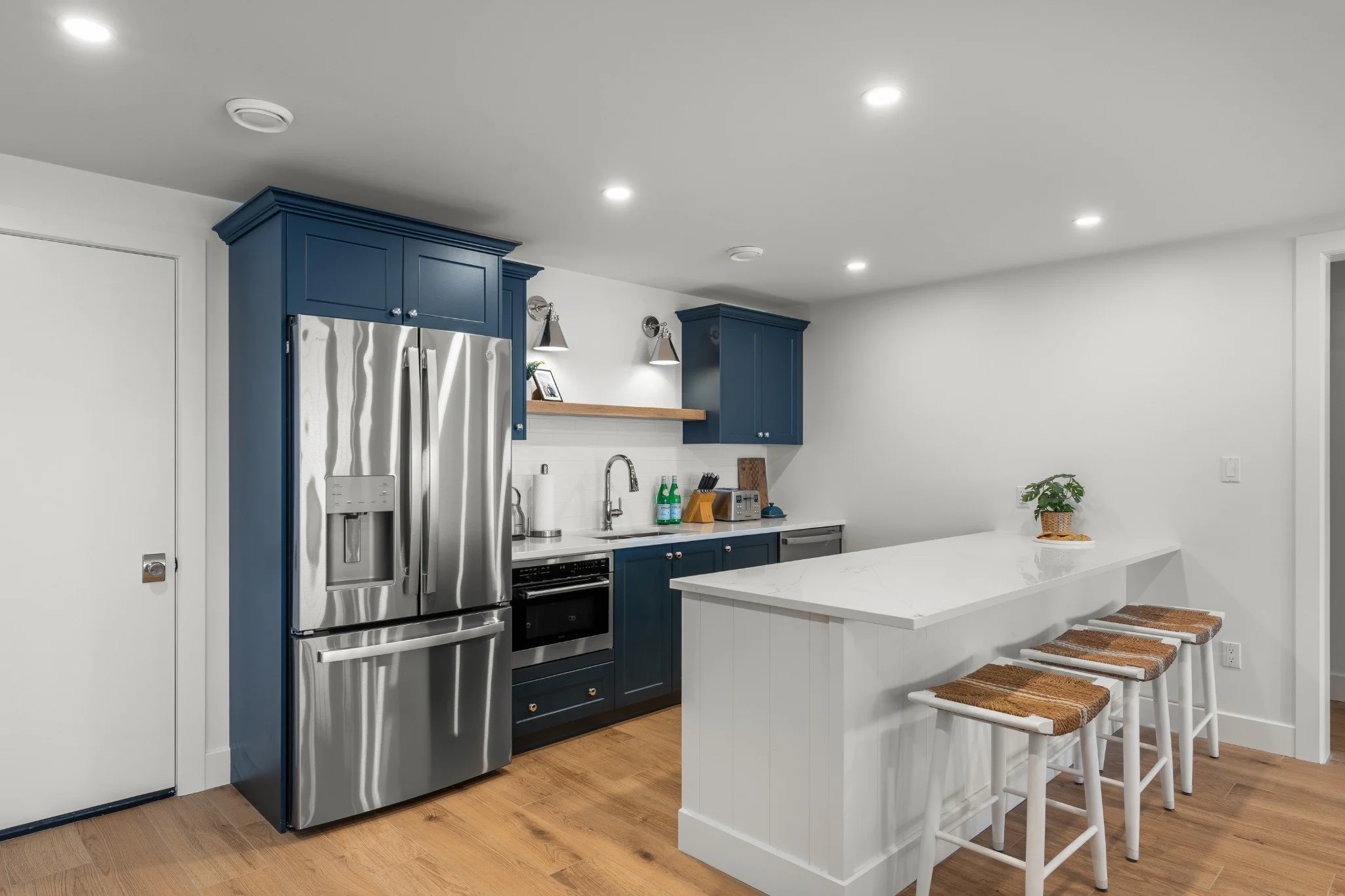 Custom kitchen cabinetry with island and warm wood finishes