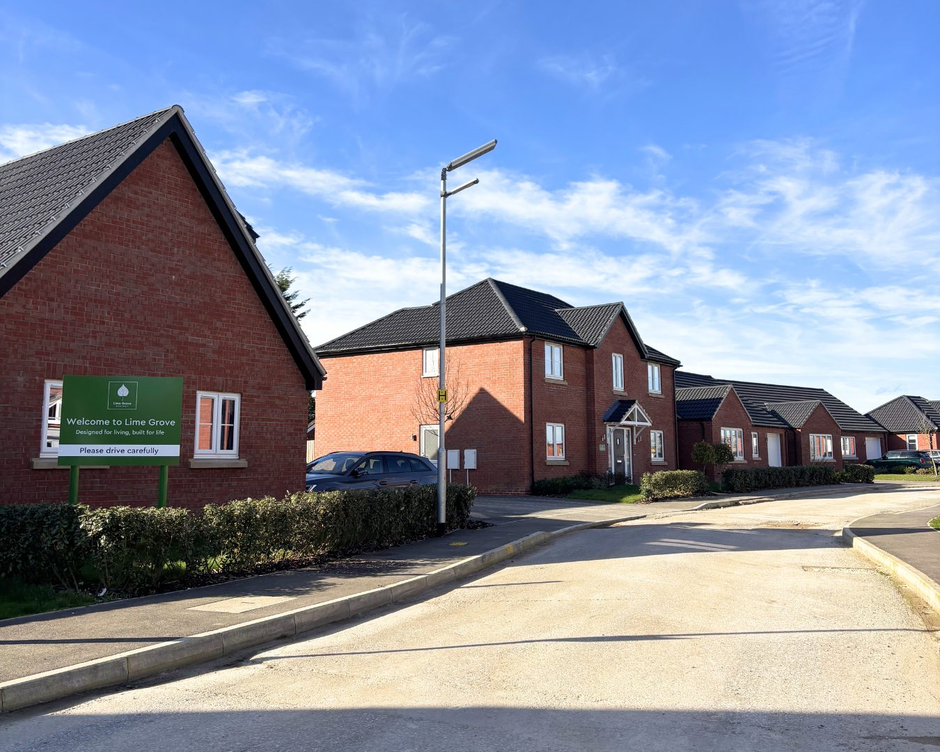 a row of red brick new build homes