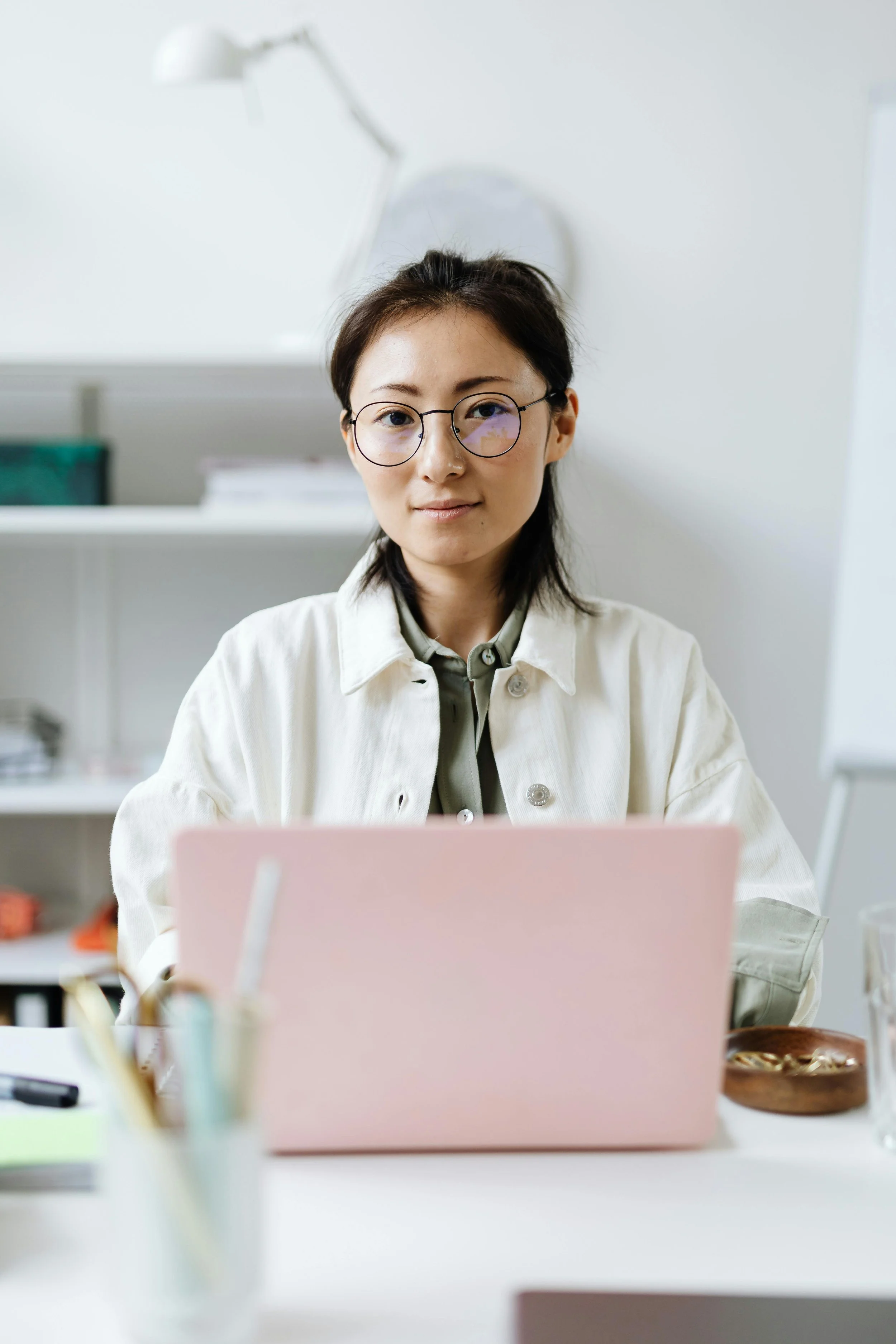 Wellness clinic owner reviewing search visibility and patient acquisition strategy on laptop