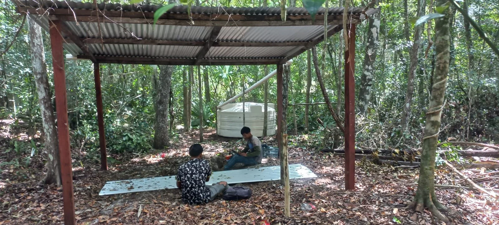 Installing rain water capturing system in nueva vida calakmul.jpg