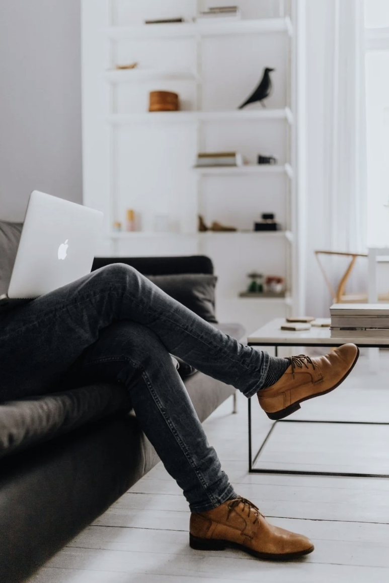 Exhausted entrepreneur working late experiencing shadow burnout while appearing successful