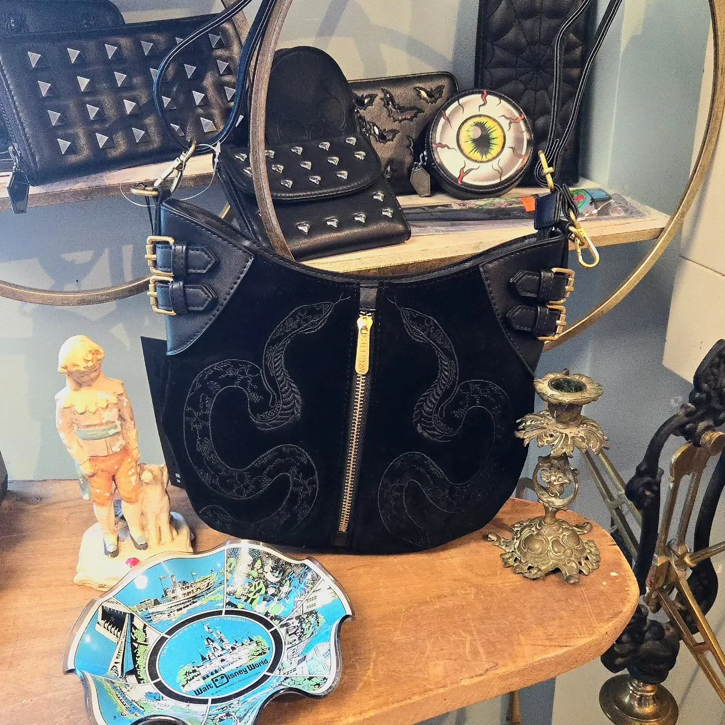 🐍 If you missed out on the Viper purse the first time around, its back in stock at Curiouser &amp; Curiouser AVL!
.
.
.
.
.
.
.
.
.
.
.
.
.
.
.
.
#downtownasheville #keepashevilleweird #ashevilleghosttours #ashevilleghost