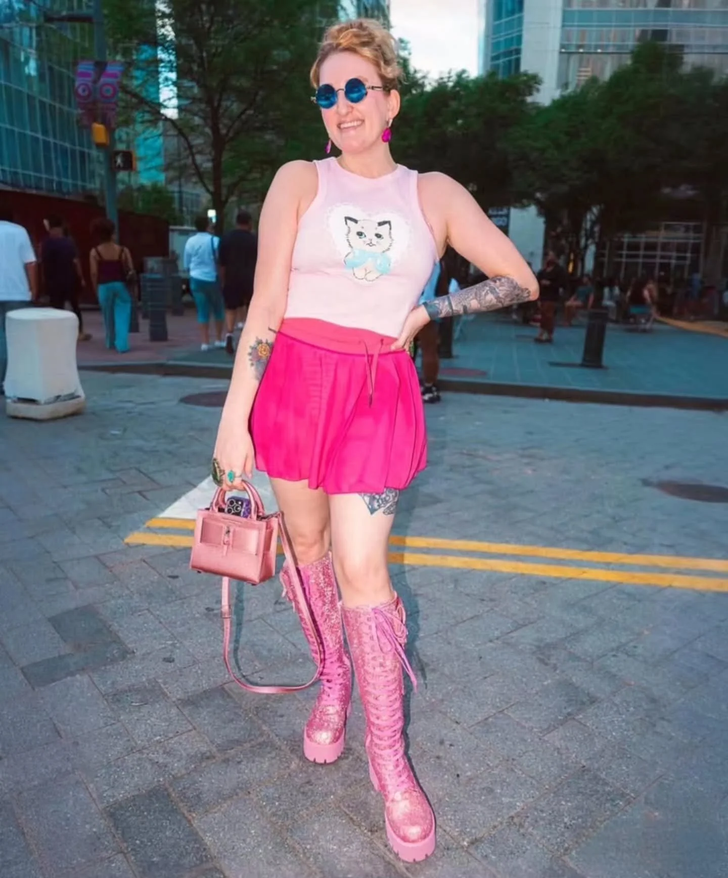 🎀 @thebig_meowski looks pretty in pink in this top by @mischief_made_me ! 💌 we still have a couple of these left in stock at Curiouser Avl
We also have a TON of other Mischeif Made design. 
📷 @velvet.alfredo