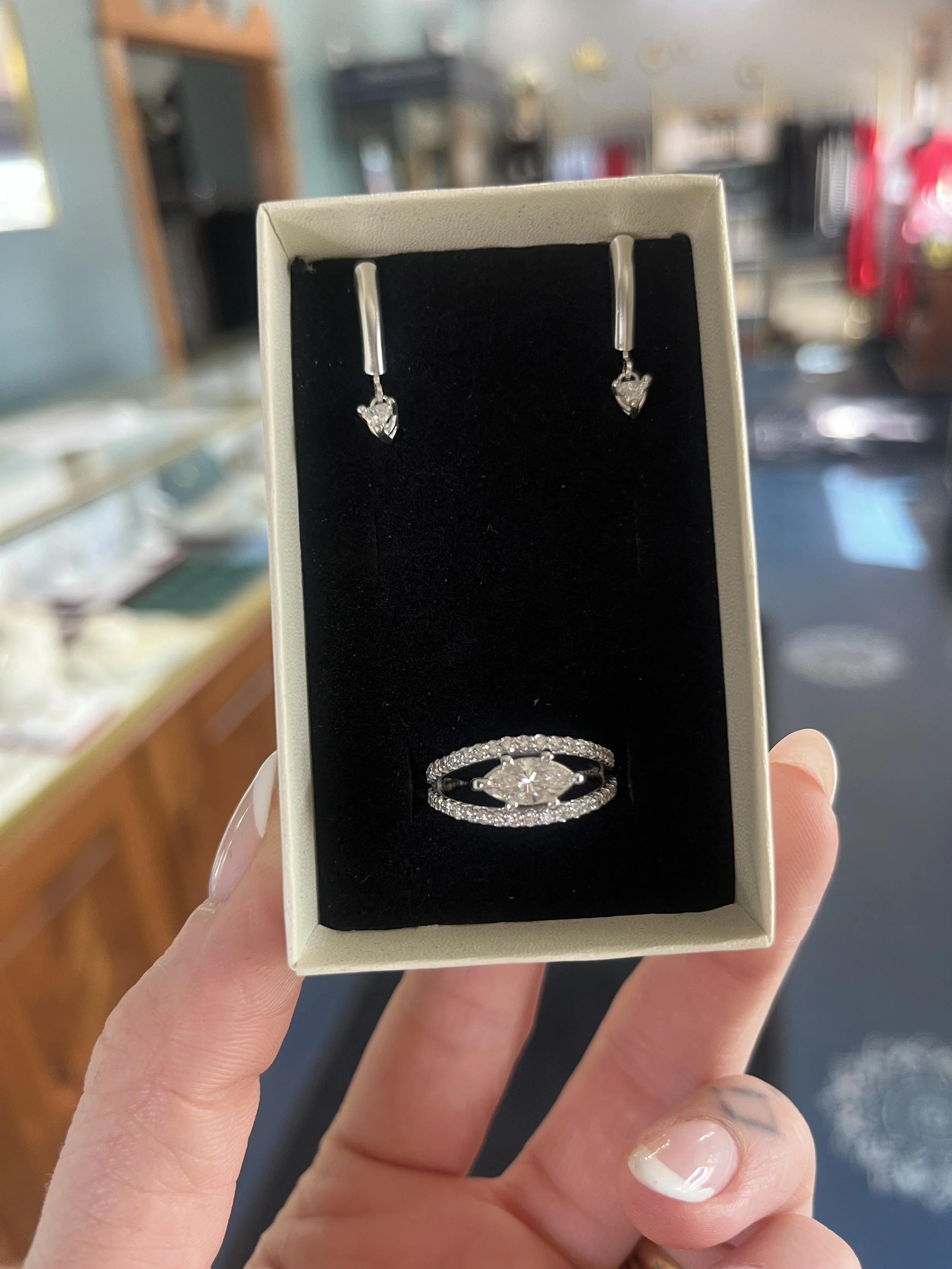 A custom east west marquise ring and matching earrings created by TSC Jewelry