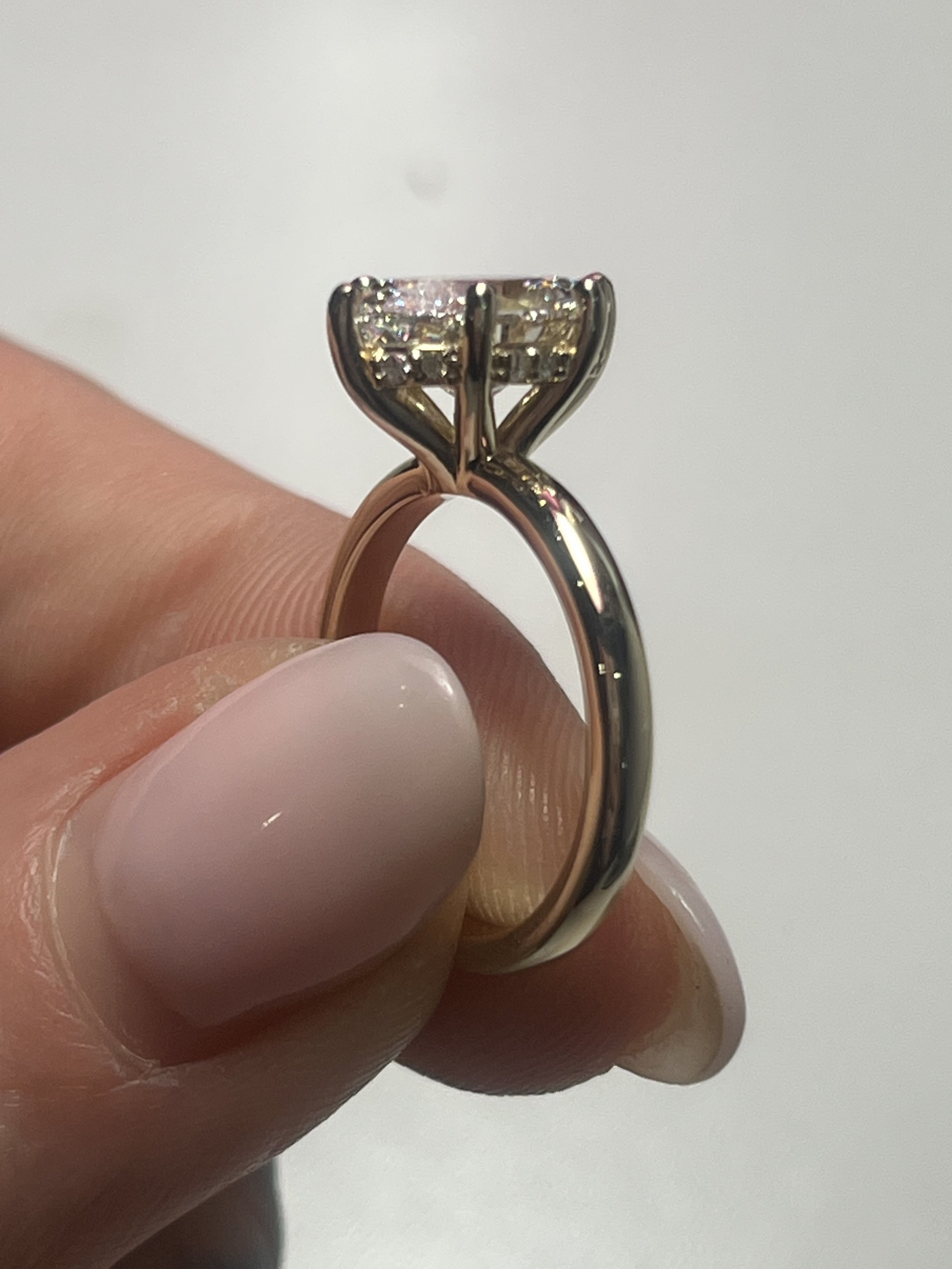 a close up photo showcasing the hidden halo on a gorgeous 2 carat diamond engagement ring by TSC Jewelry