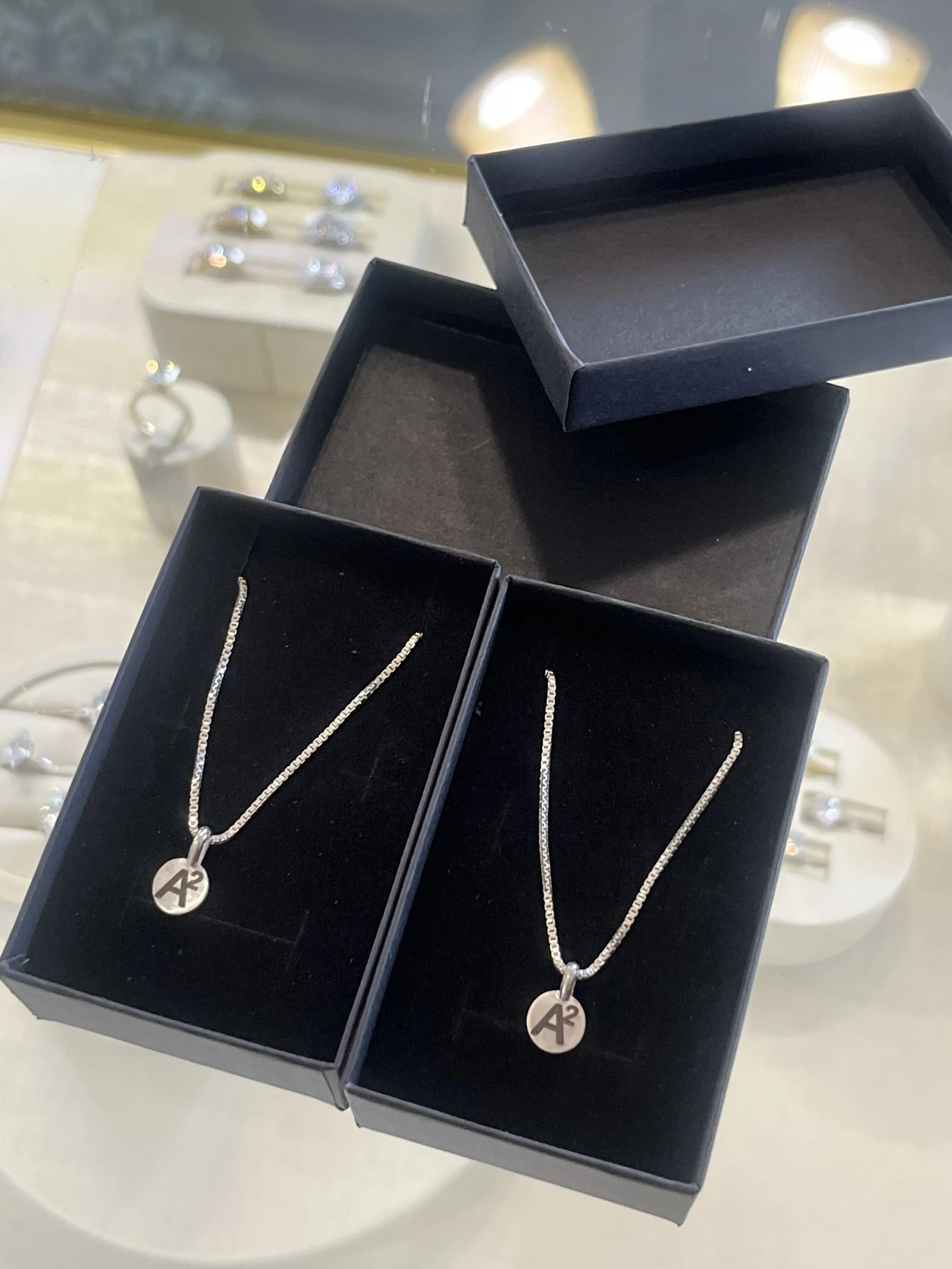 Two custom engraved sterling silver necklaces by TSC Jewelry